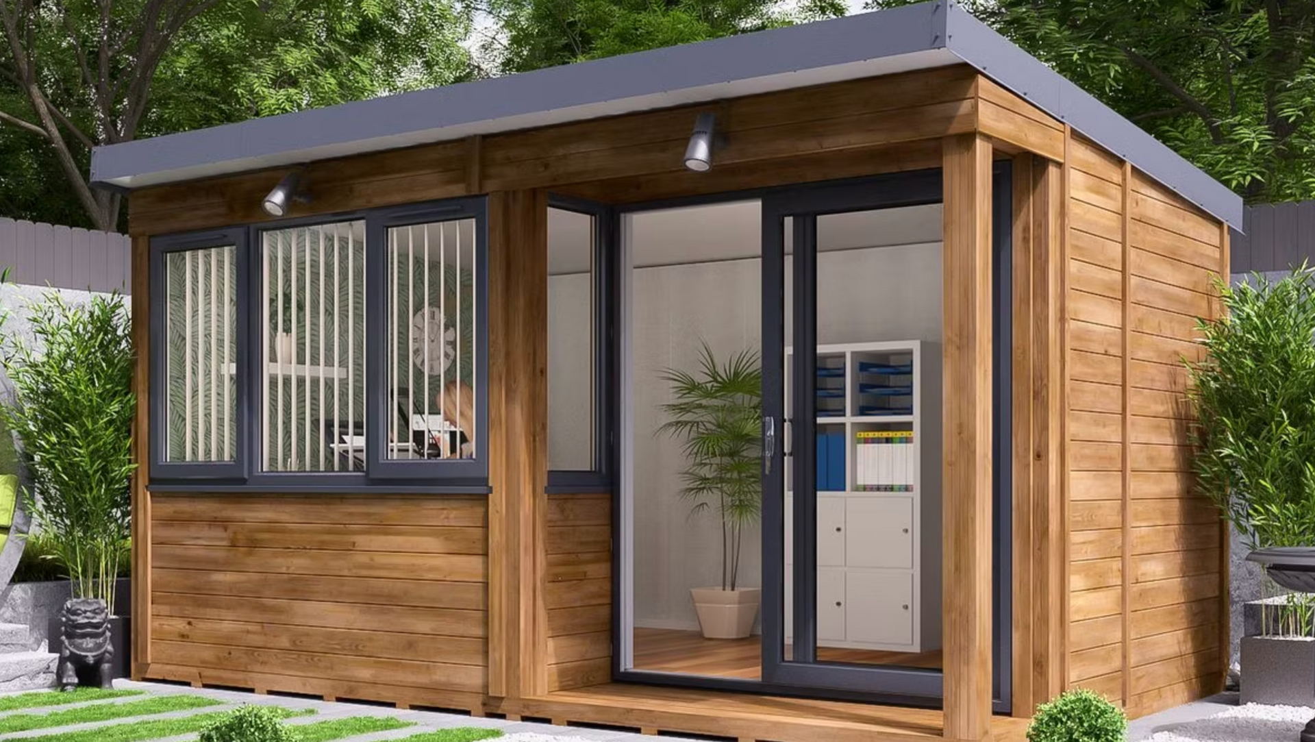 Wooden garden office with gray trim and glass doors, set in a backyard.