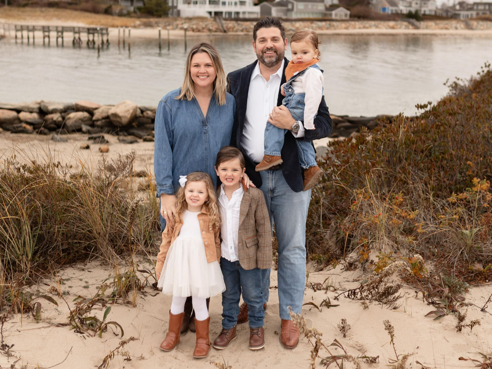 An elderly couple and a young girl are sitting next to each other.