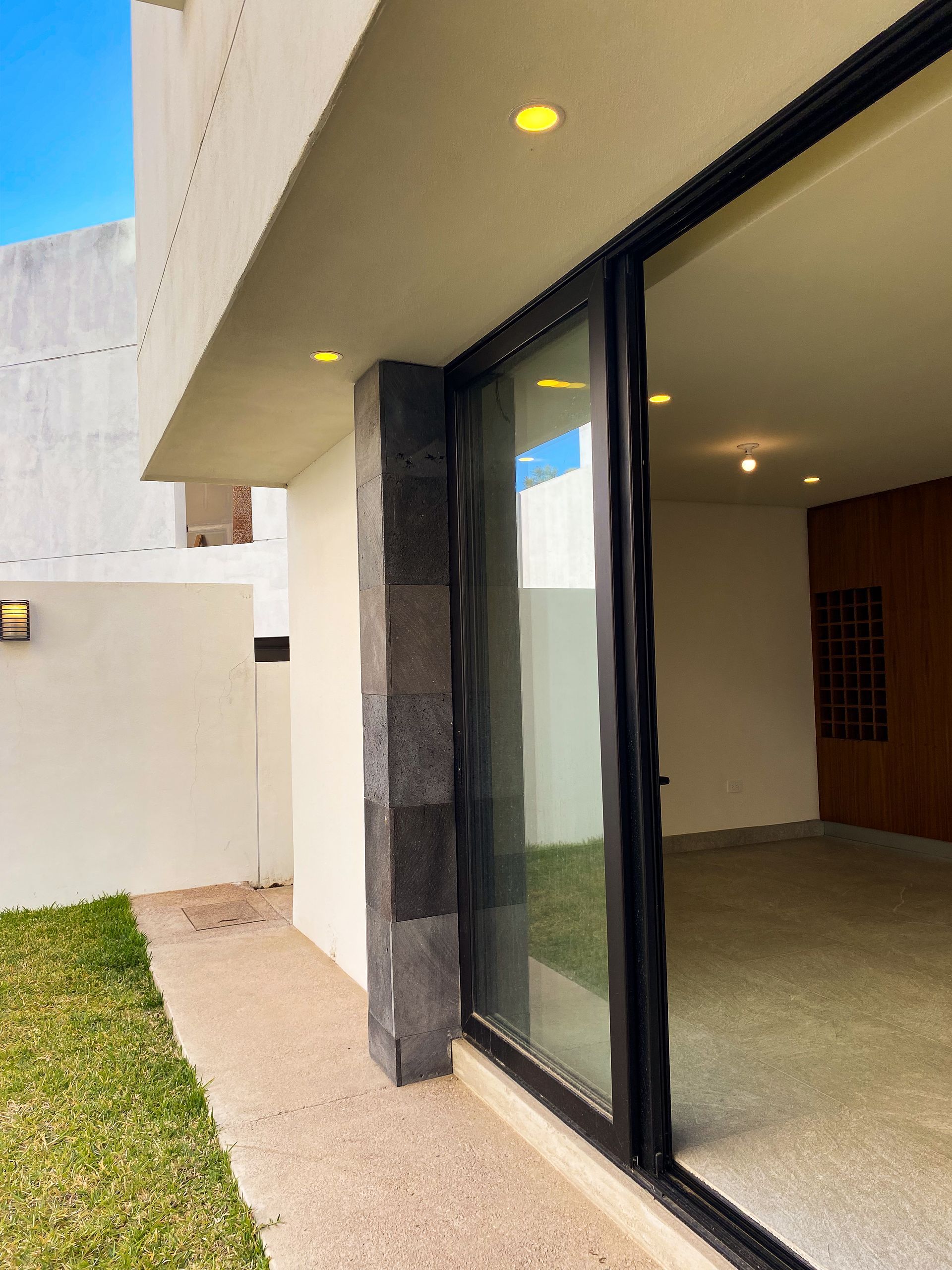 A house with a sliding glass door that is open