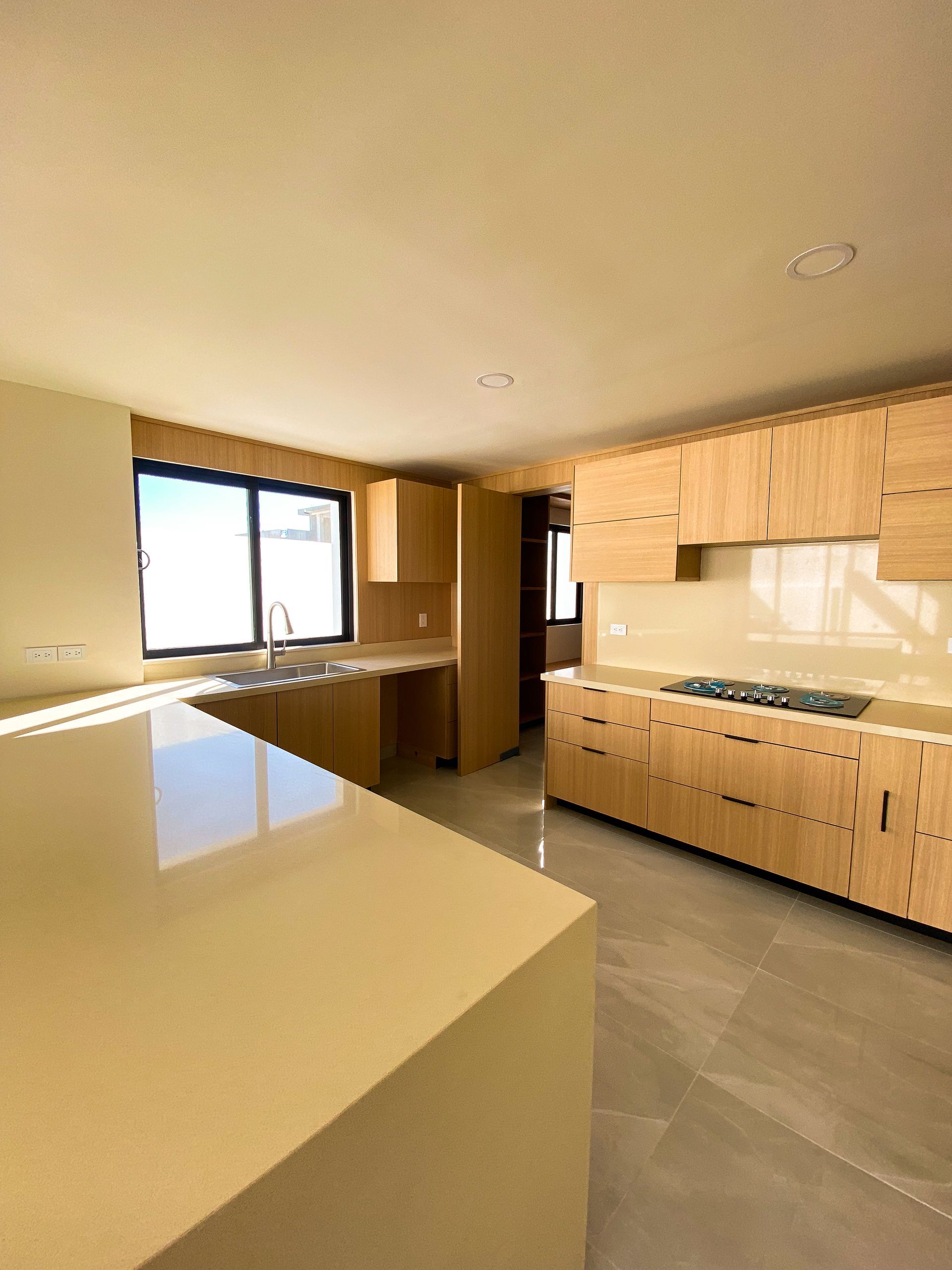 A kitchen with wooden cabinets and granite counter tops
