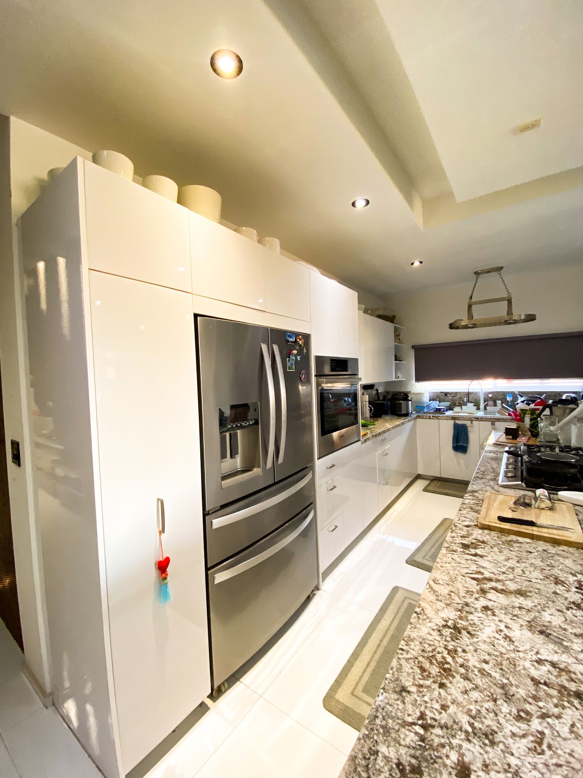 A kitchen with stainless steel appliances and granite counter tops.