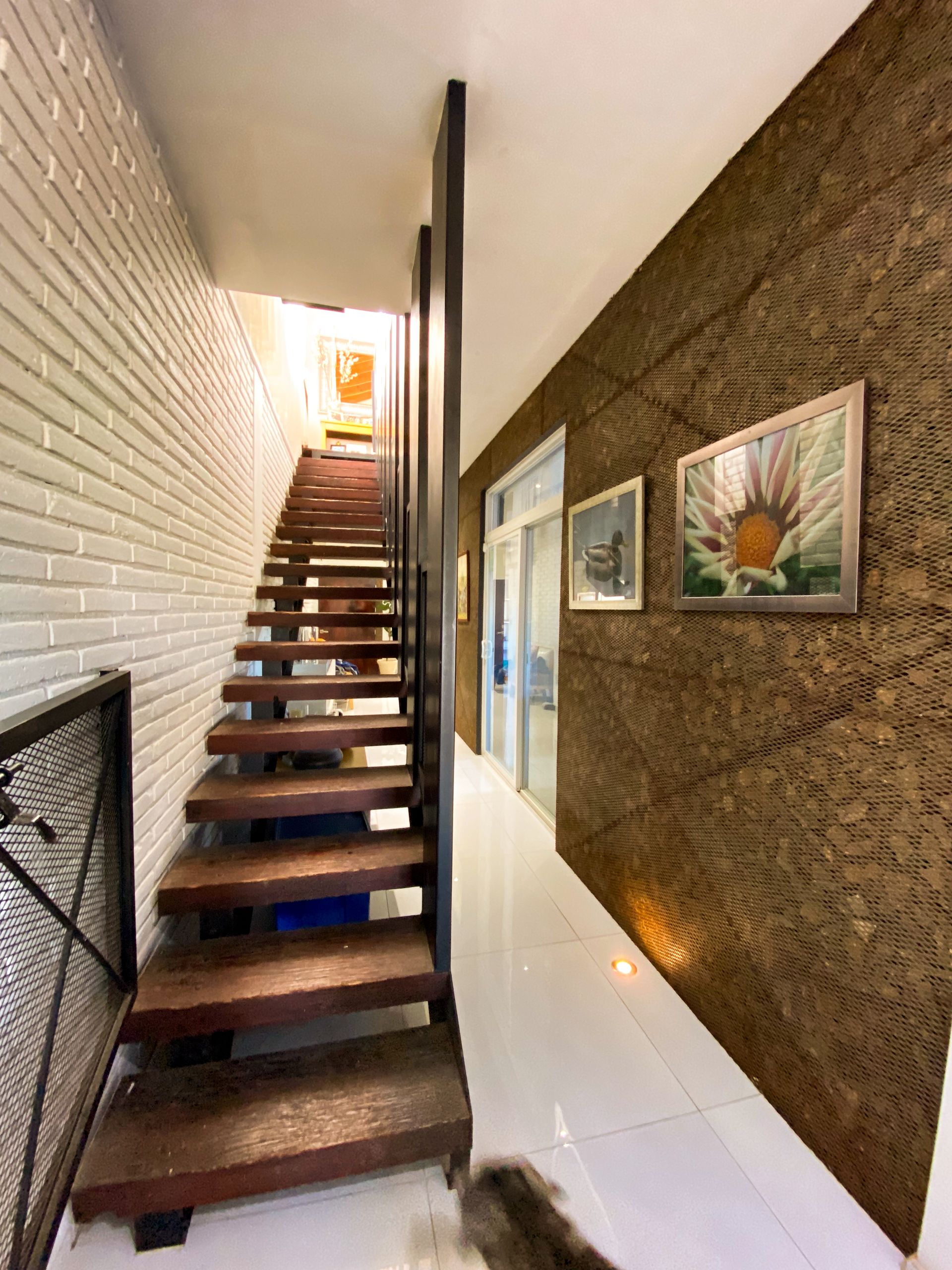 A staircase leading up to the second floor of a house