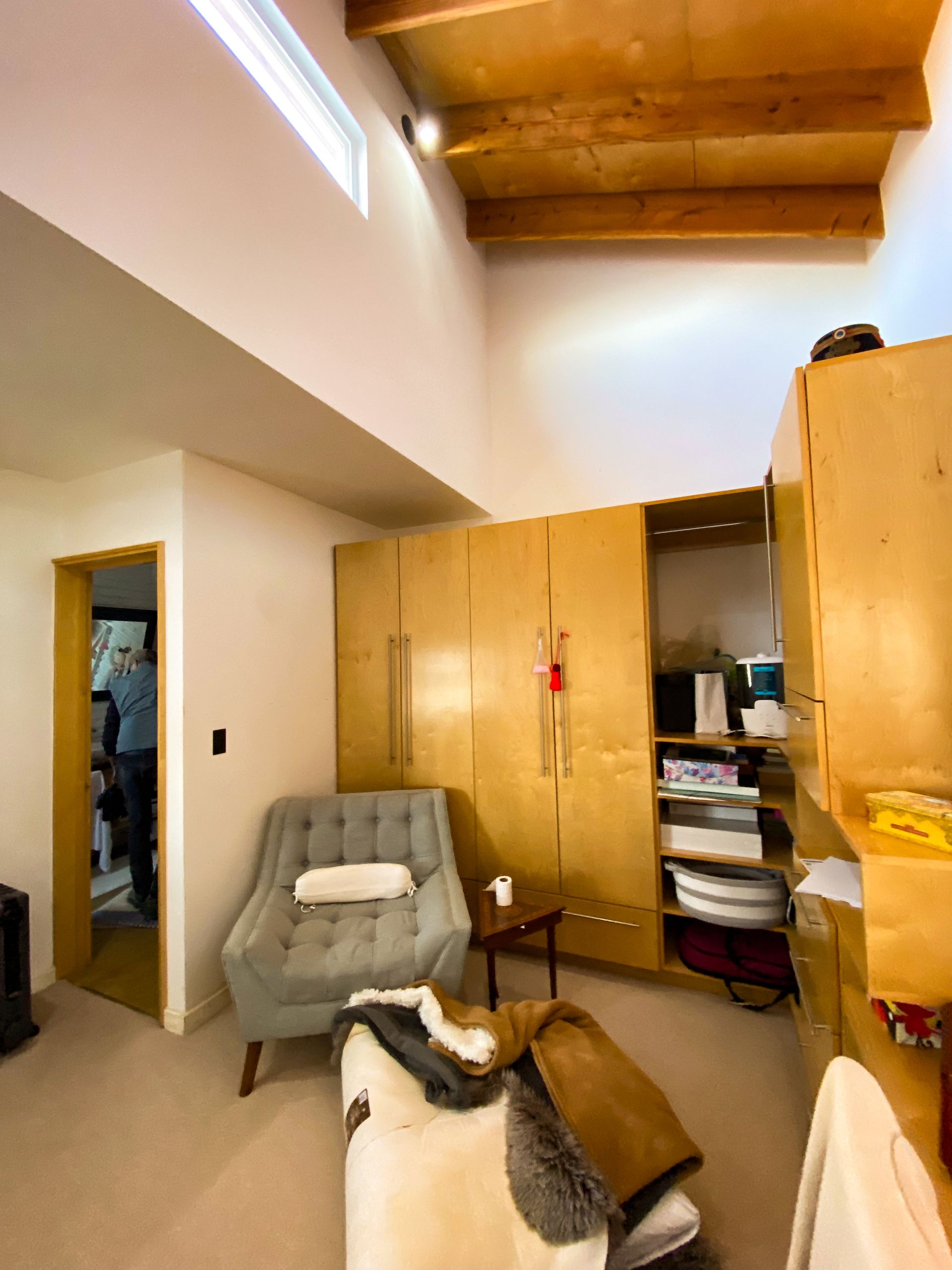 A living room with a chair and a table