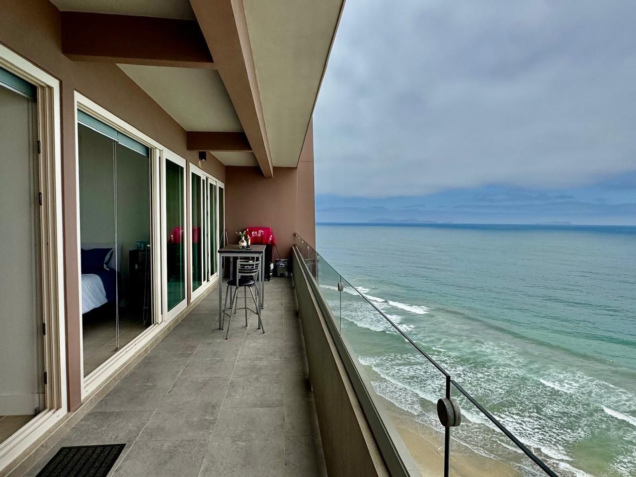 A large white house with a black garage door