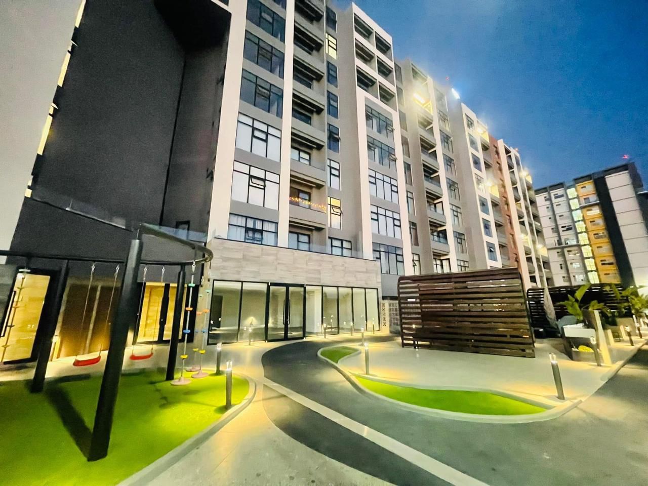 Looking up at a tall building with a blue sky in the background.