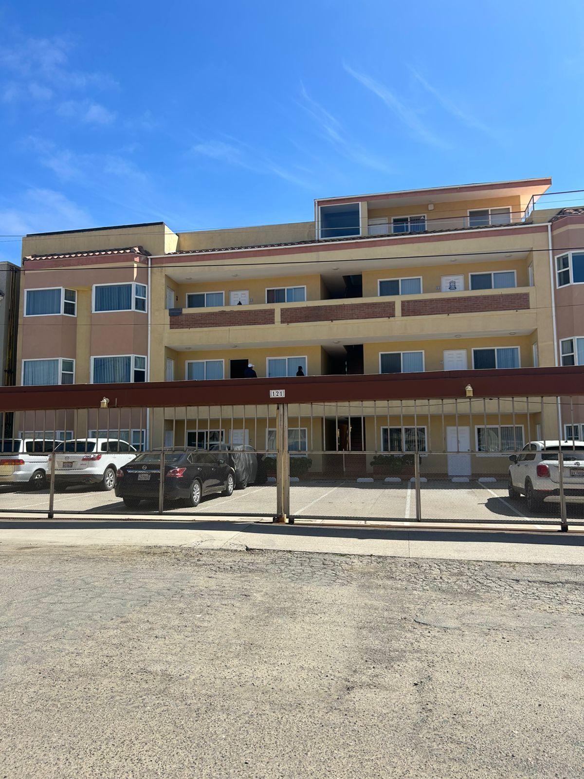 A conference room with a table and chairs and a painting on the wall.