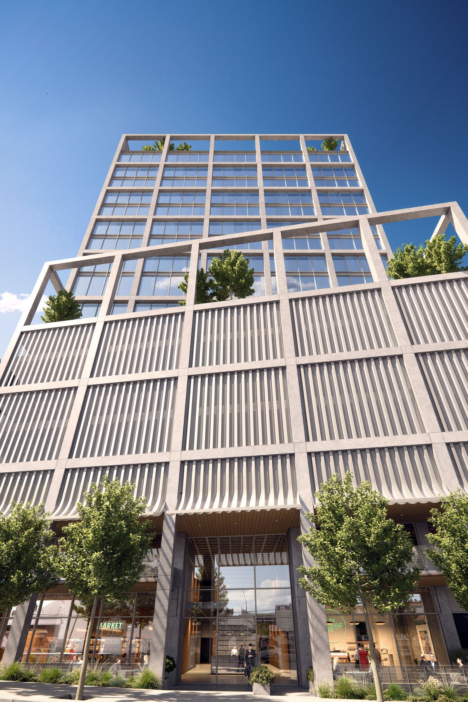 A row of cars are parked in front of a building.