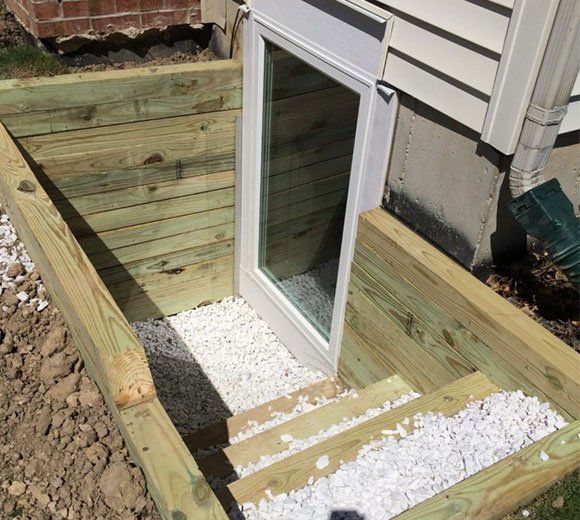 Newly Installed Basement Egress Window — Kentwood, MI — Cardinal Remodeling and Design LLC