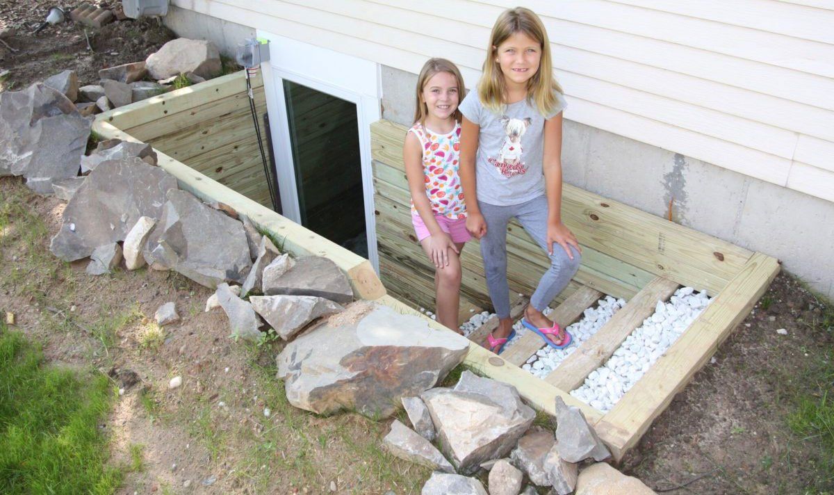 Kids Near Basement Egress Window — Kentwood, MI — Cardinal Remodeling and Design LLC