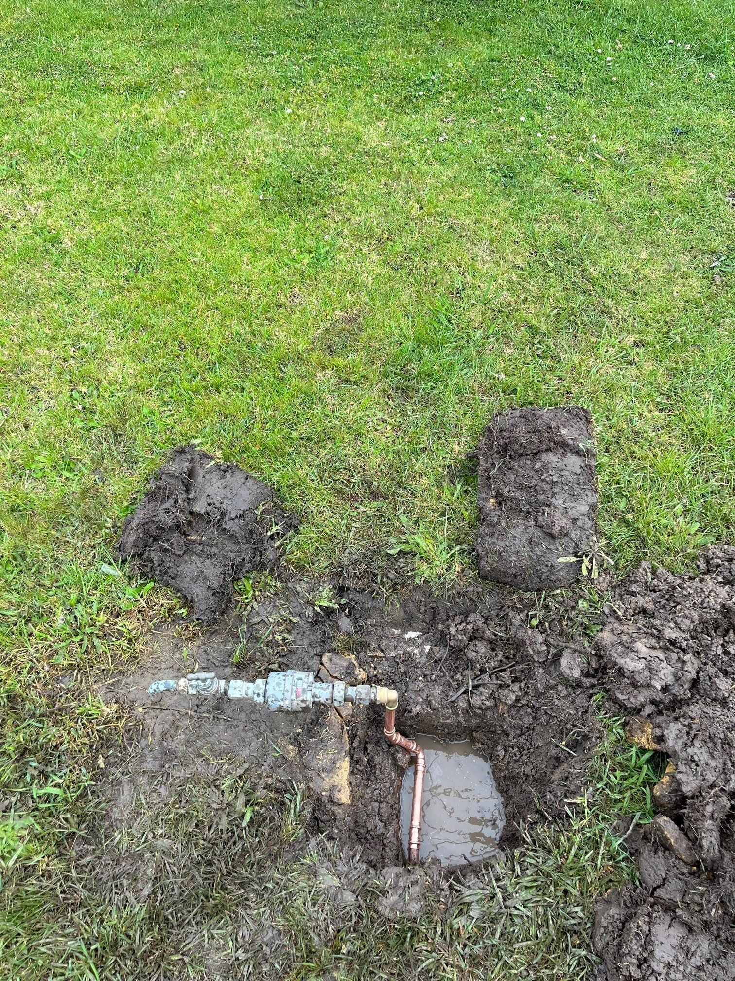 Hands Of Professional Plumber With A Orange Wrench — Distinct Plumbing Services In Shellharbour