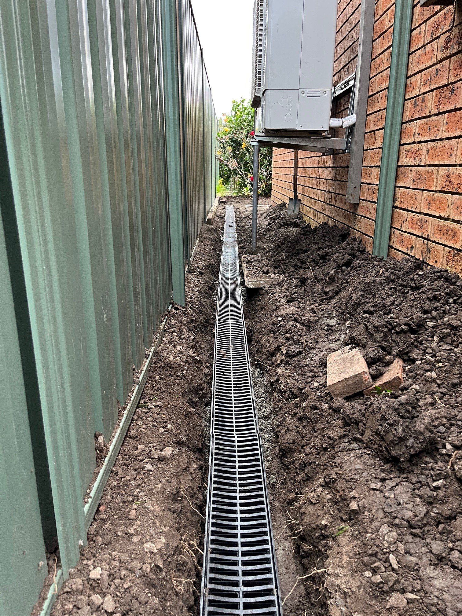 Close Up Of Man Hands Setting The Temperature Of Water In Electric Boiler — Distinct Plumbing Services In Dapto