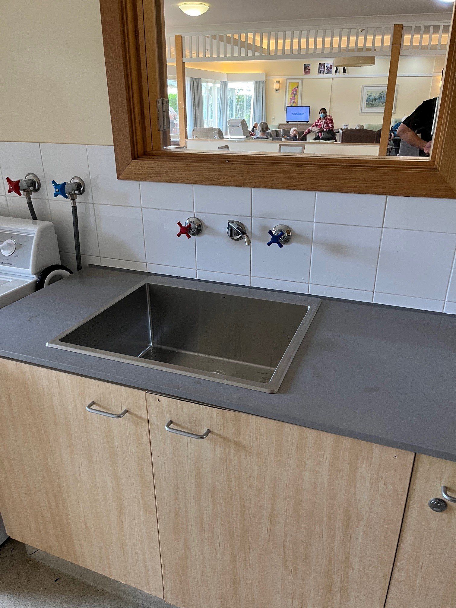 Plumber Taking Out An Old Water Heater With Scale Deposition From A Boiler In A Bathroom — Distinct Plumbing Services In Wollongong