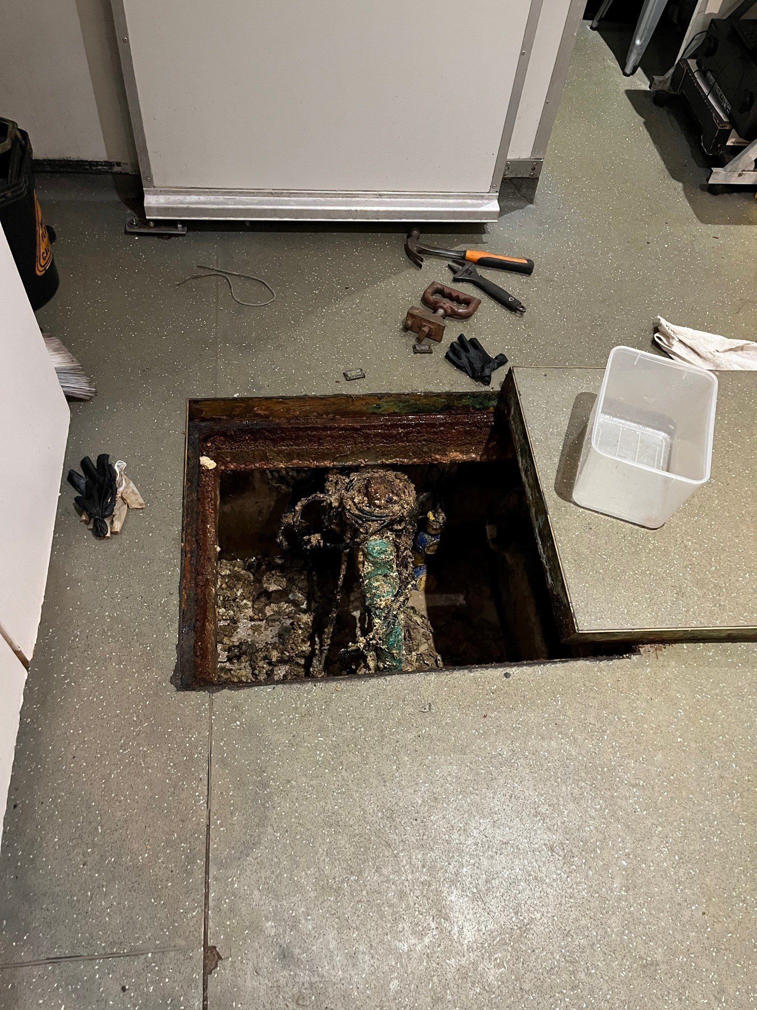 Plumber Replacing Faucet In Kitchen, Close Up View — Distinct Plumbing Services In Wollongong