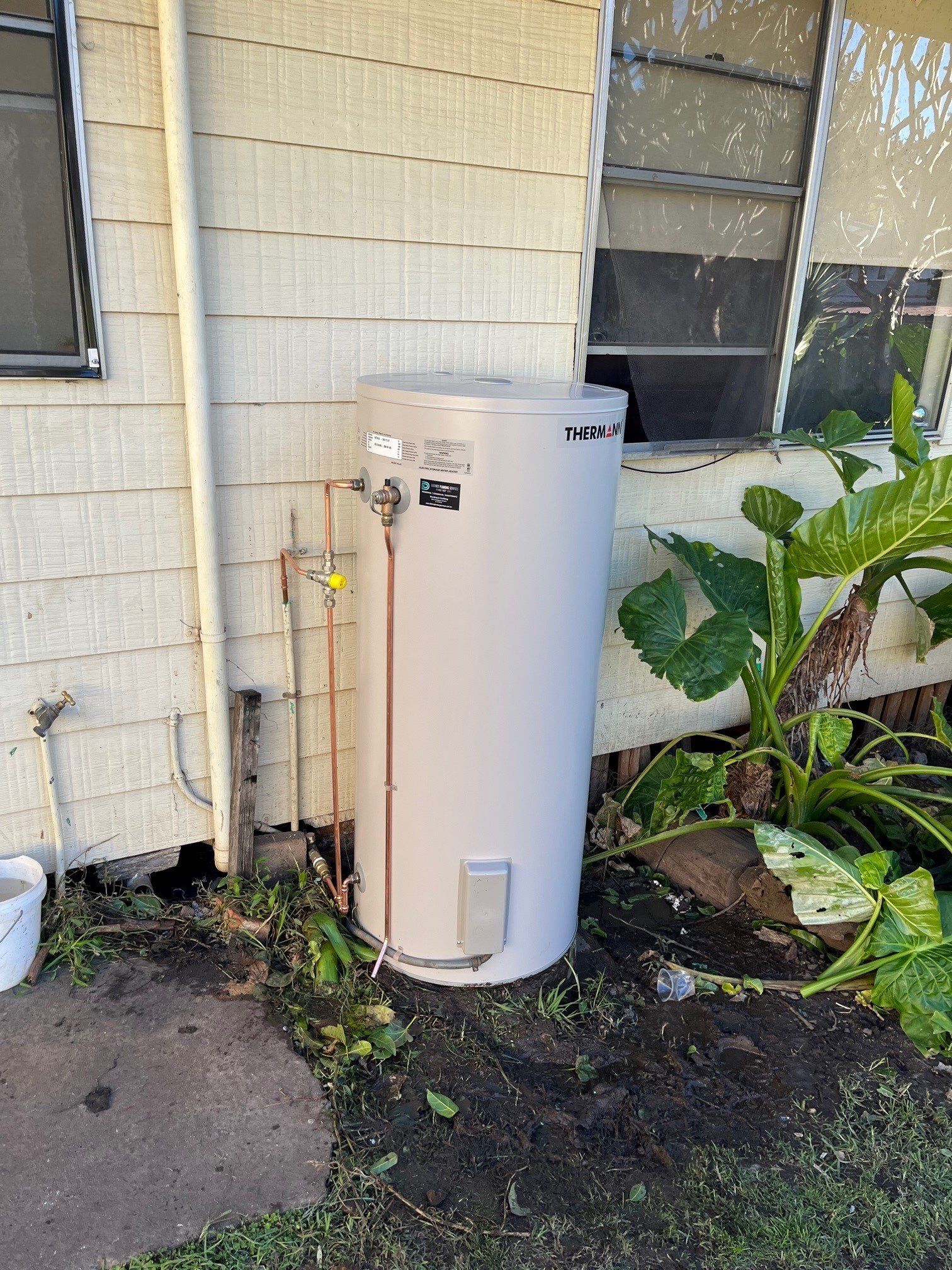 Man Working At Pipes — Distinct Plumbing Services In Wollongong