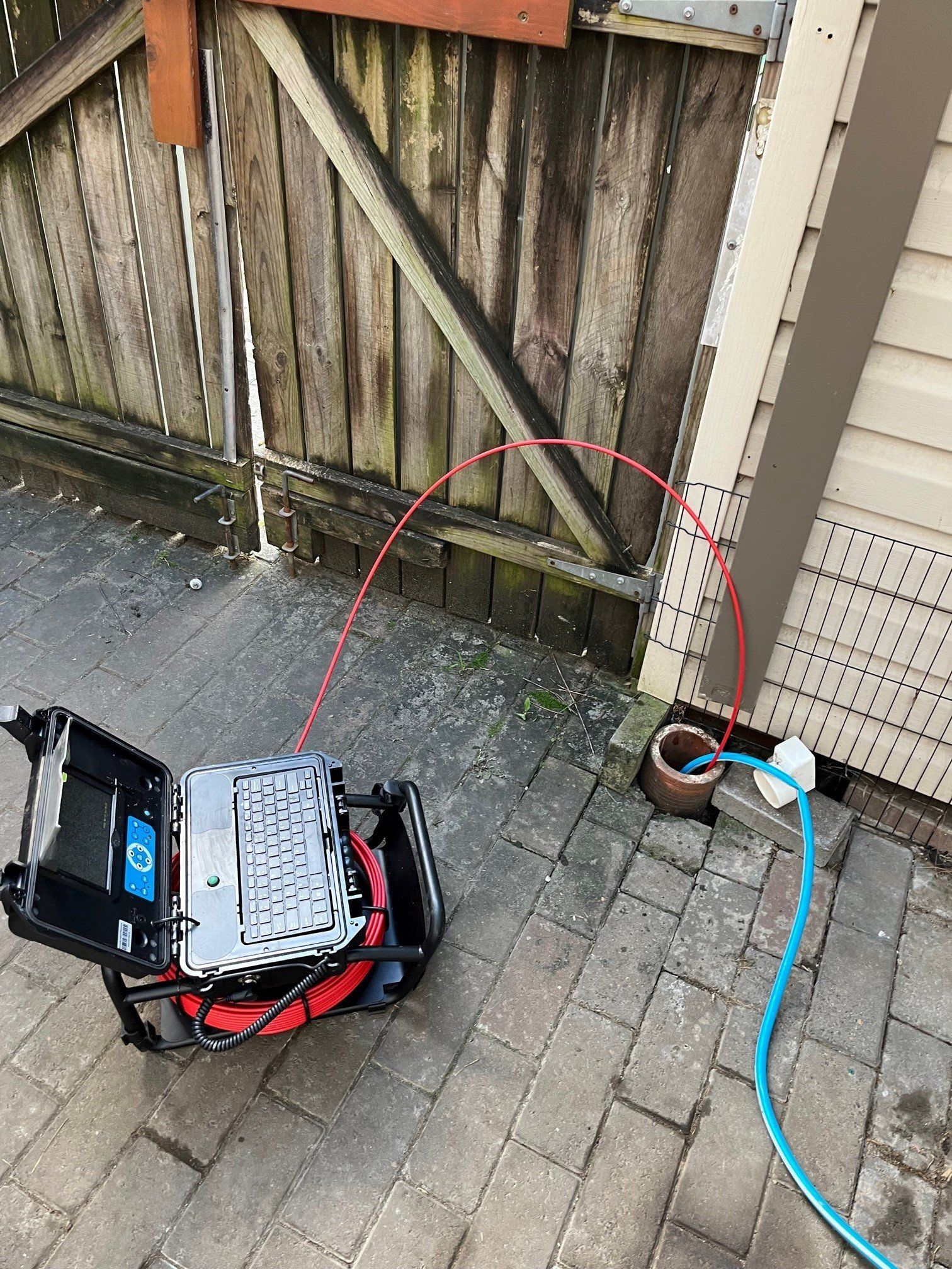 Plumber With Plumbing Tools On The Kitchen — Distinct Plumbing Services In Barrack Heights NSW