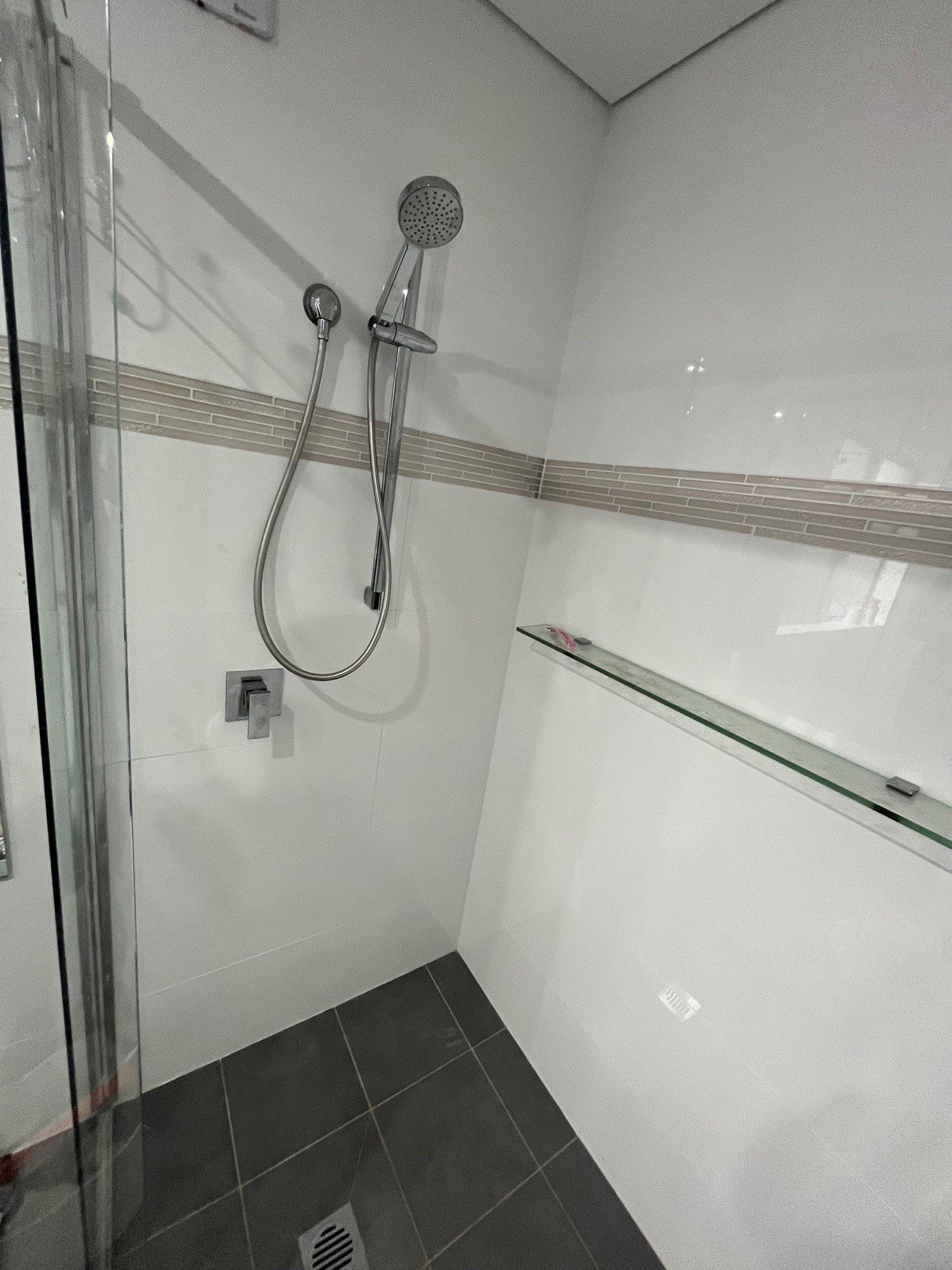 Plumber Repairing Toilet Cistern At Water Closet — Distinct Plumbing Services In Dapto