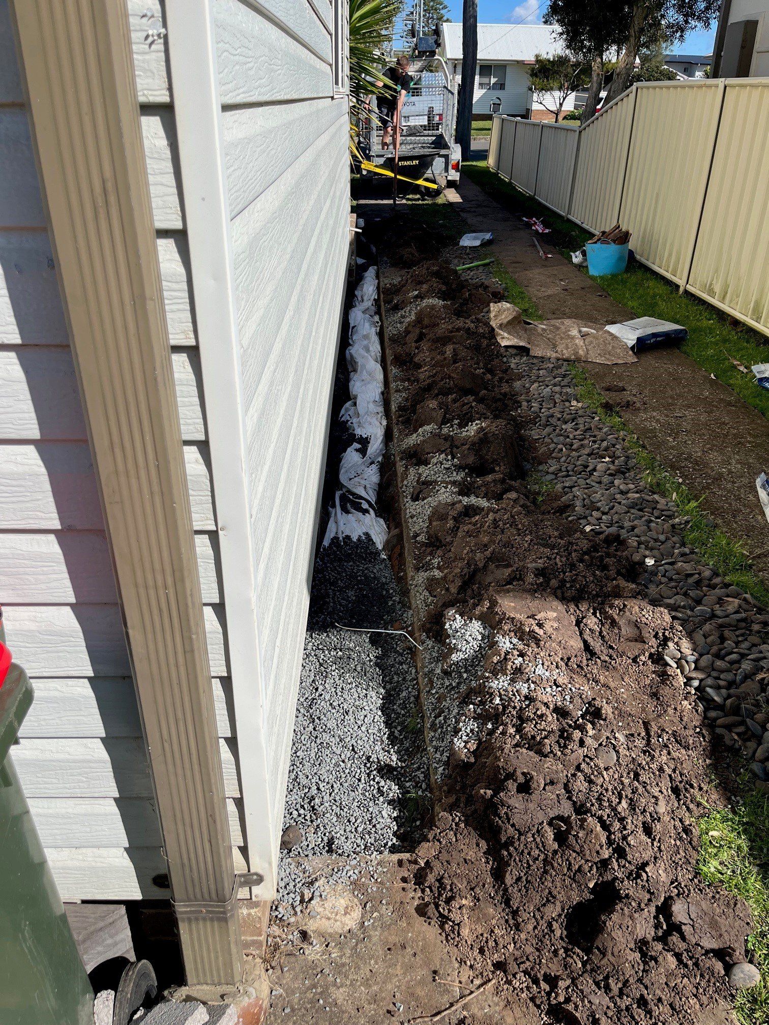 Male Plumber Fixing Water Meter With Adjustable Wrench — Distinct Plumbing Services In Barrack Heights NSW