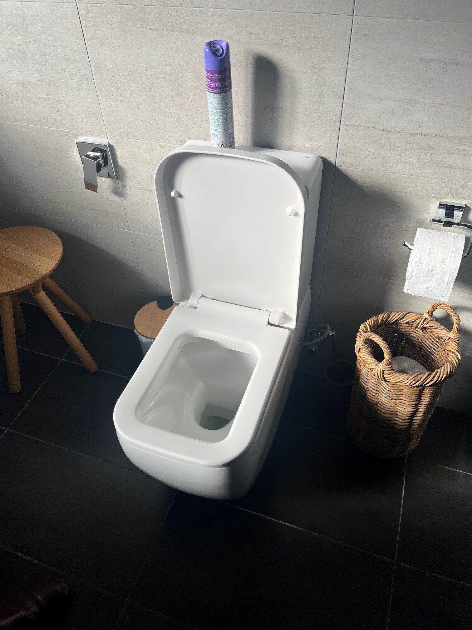 A Close Up Of A Plumber Installing An Electrical Hot Water Cylinder — Distinct Plumbing Services In Wollongong