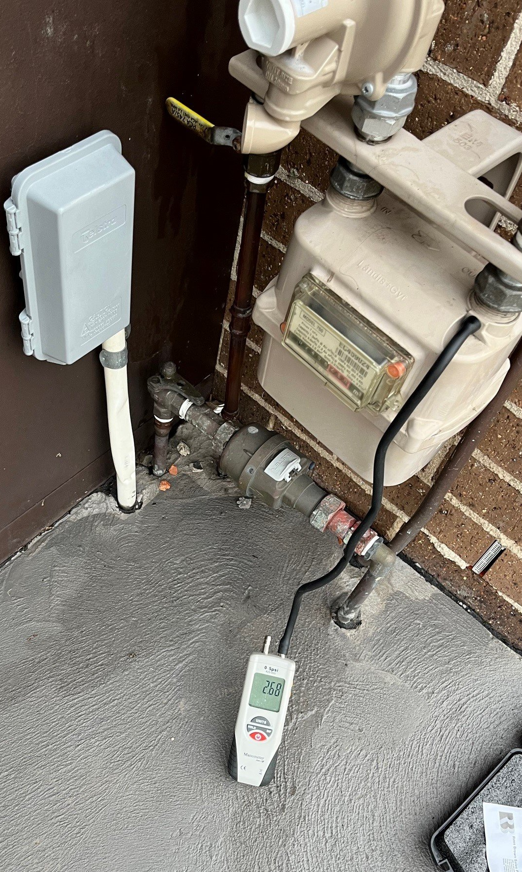 Male Plumber Repairing Solar Energy Electric Boiler — Distinct Plumbing Services In Barrack Heights NSW