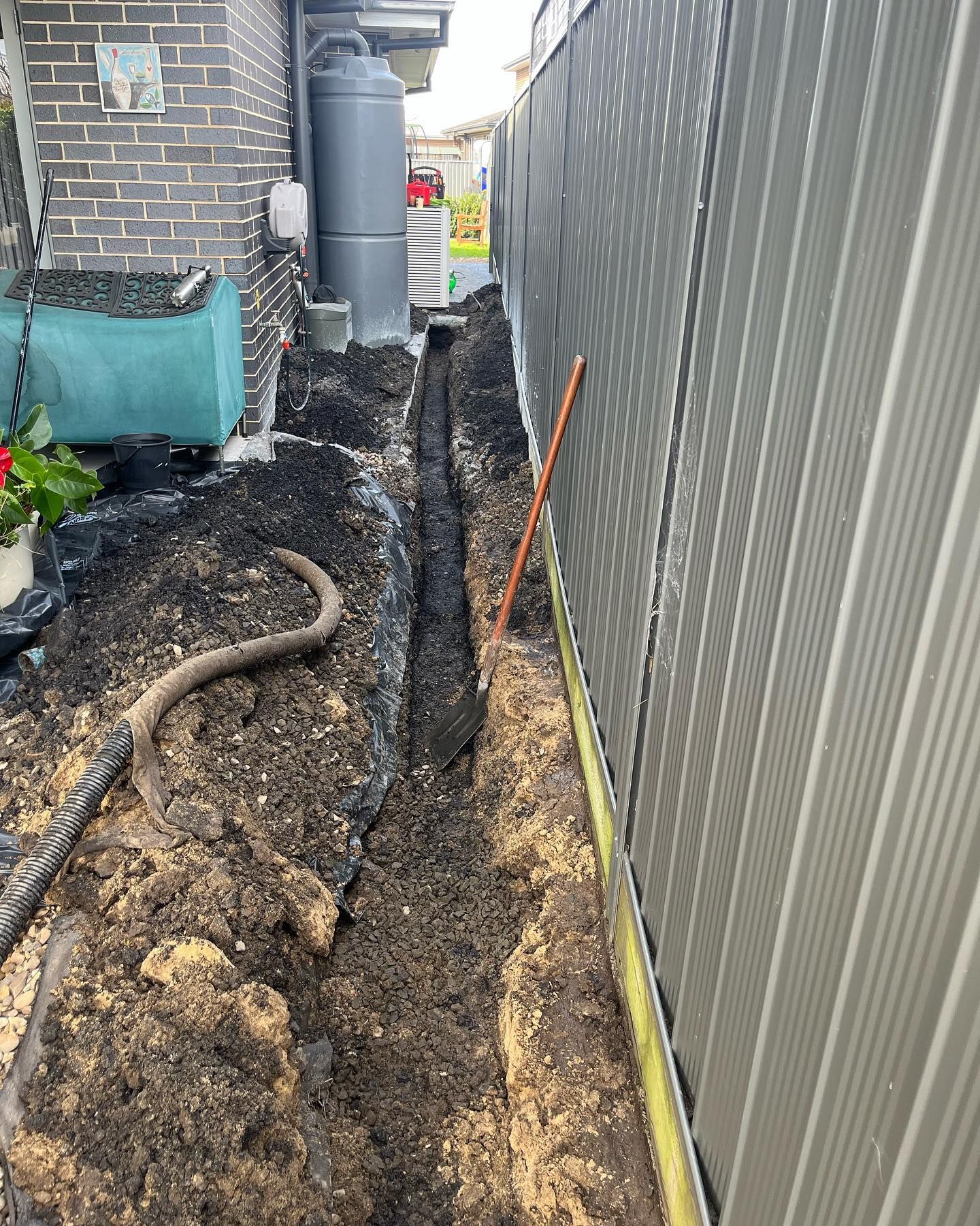Plumber Repairing a Blocked Drainage — Distinct Plumbing Services In Kiama, NSW