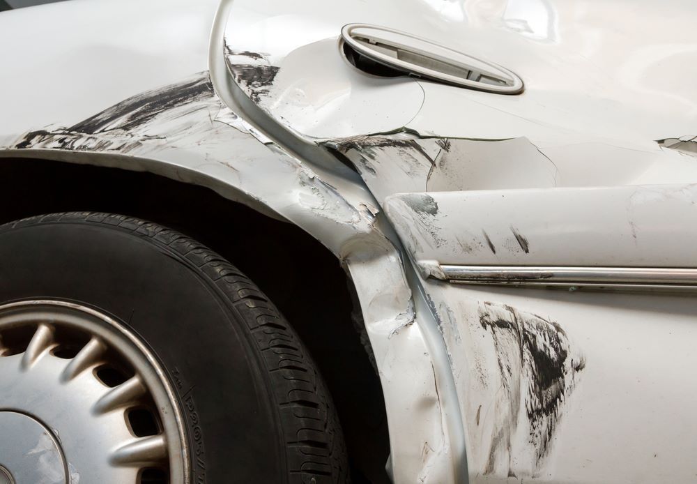 A Close Up of a Car With a Damaged Fender — Camden Haven Panel Works In Laurieton, NSW