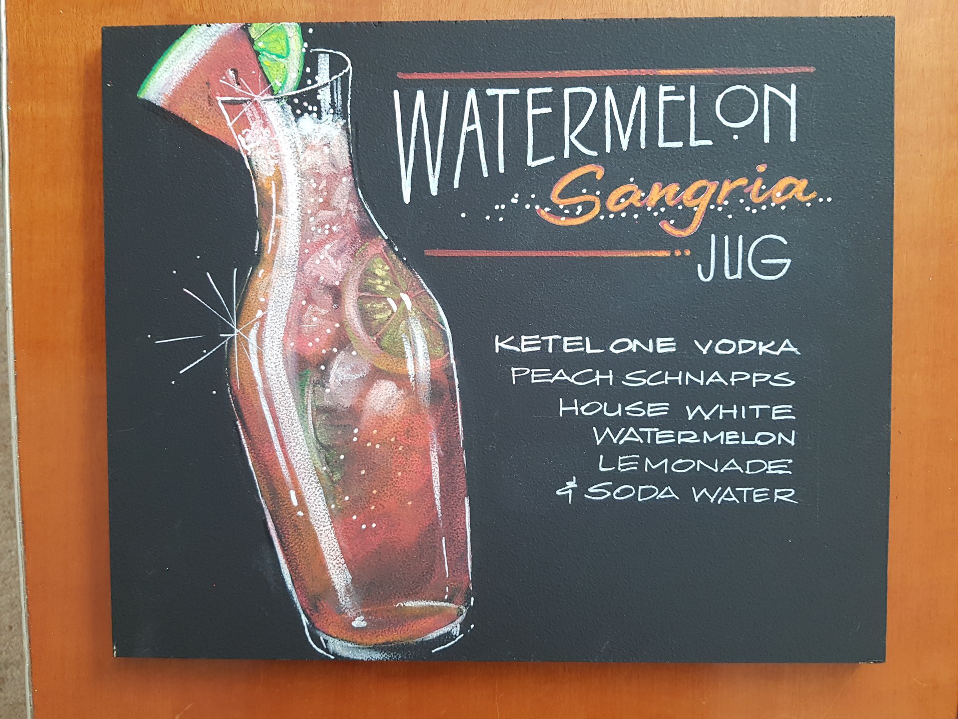 A chalkboard drawing of a watermelon sangria jug