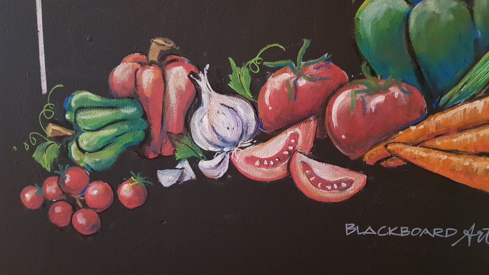 A chalk drawing of vegetables on a blackboard