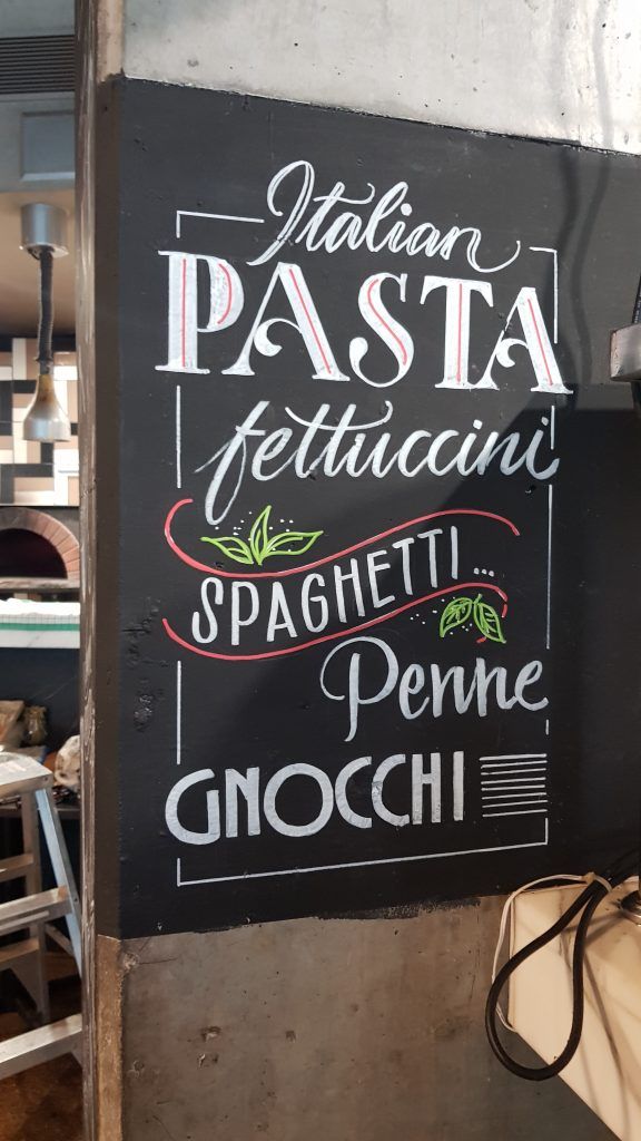 A blackboard with italian pasta written on it