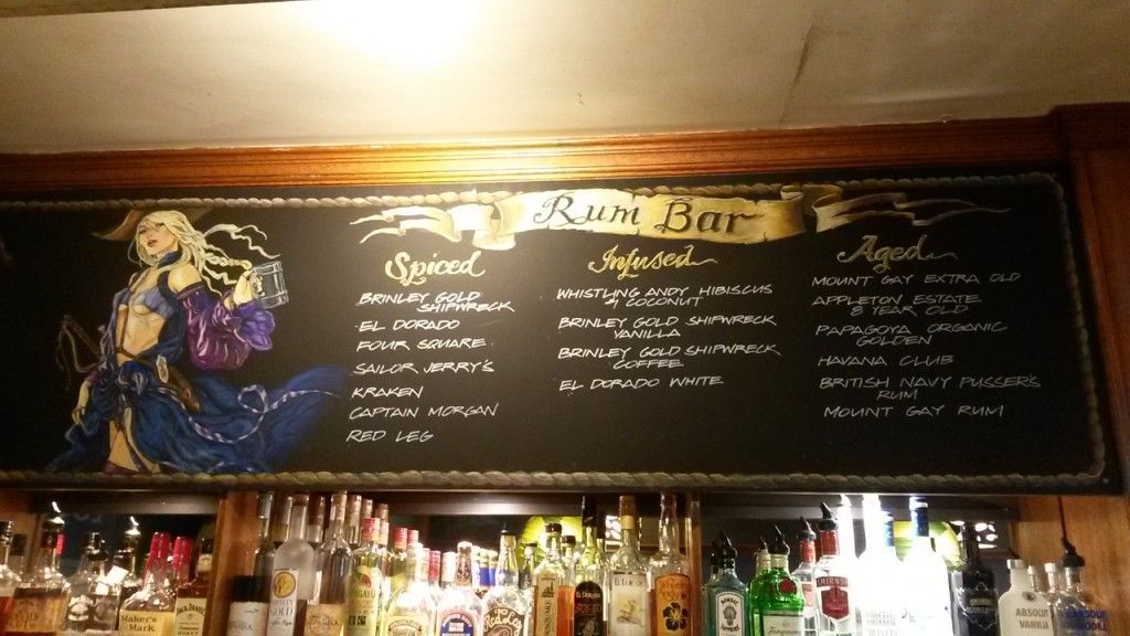 A chalkboard with rum bar written on it