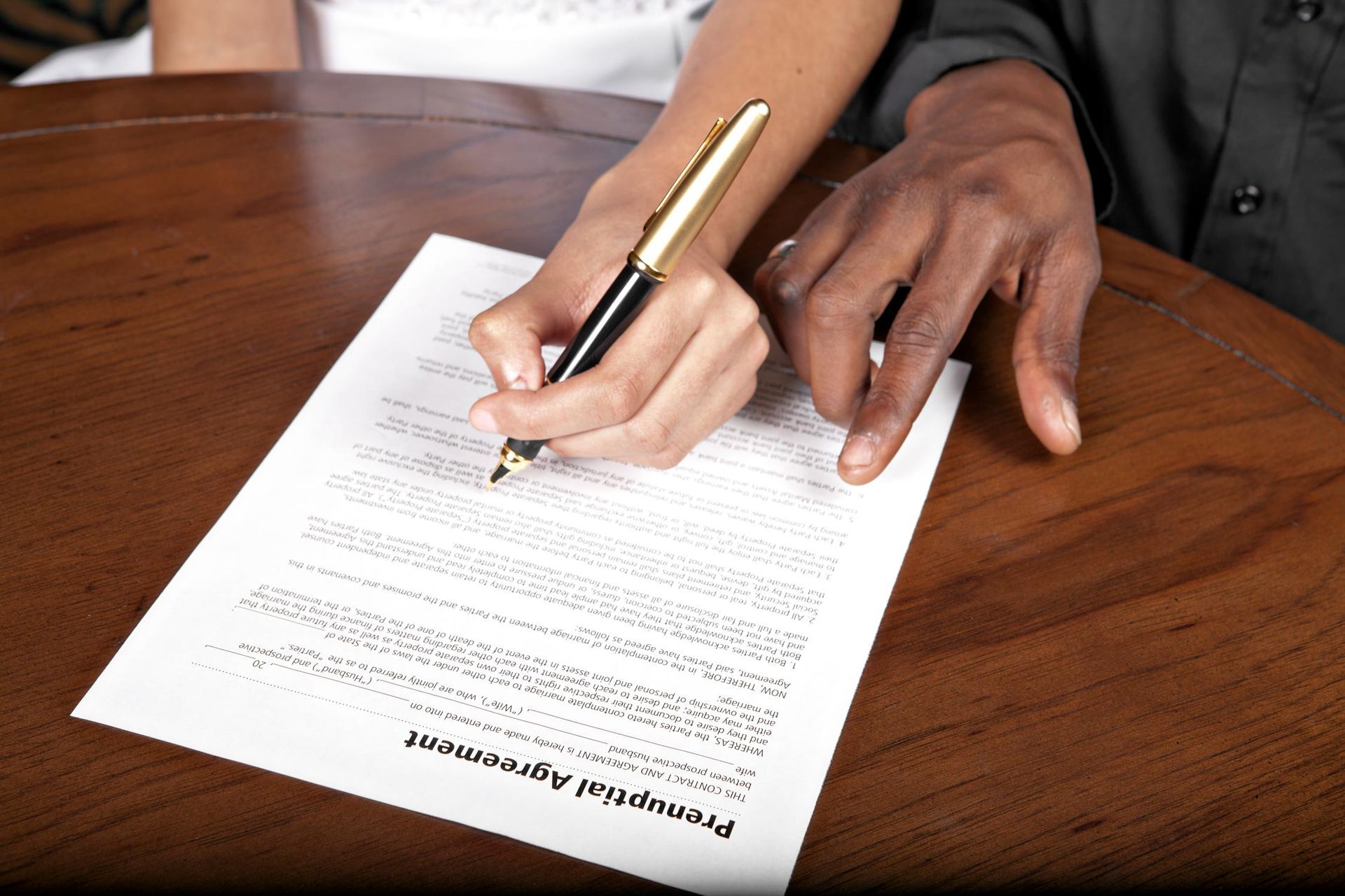 Close-up of a person signing a contract at Budget Divorce Center in Fort Myers, FL. Divorce Mediatio