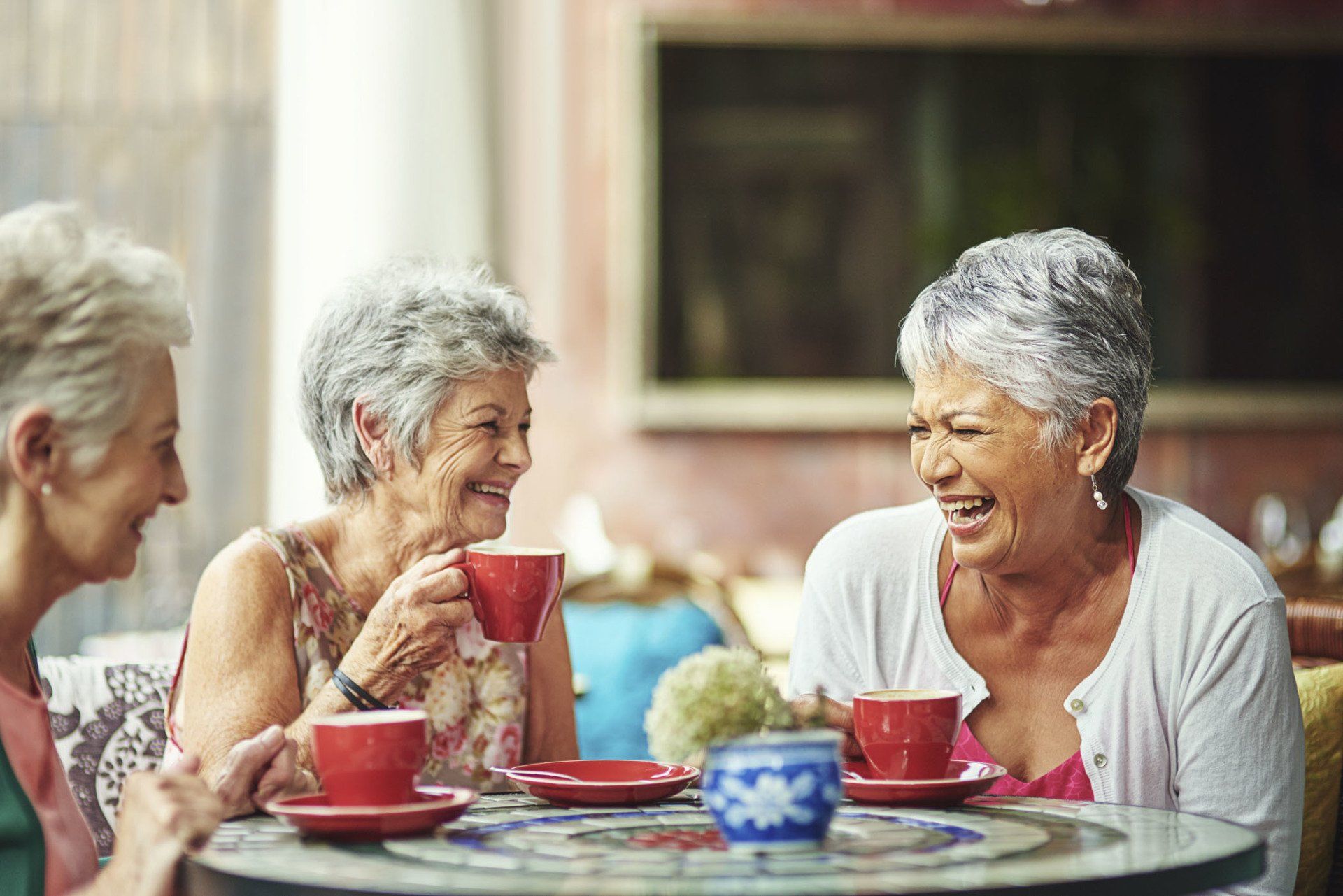 Lifelong friends catching up over coffee