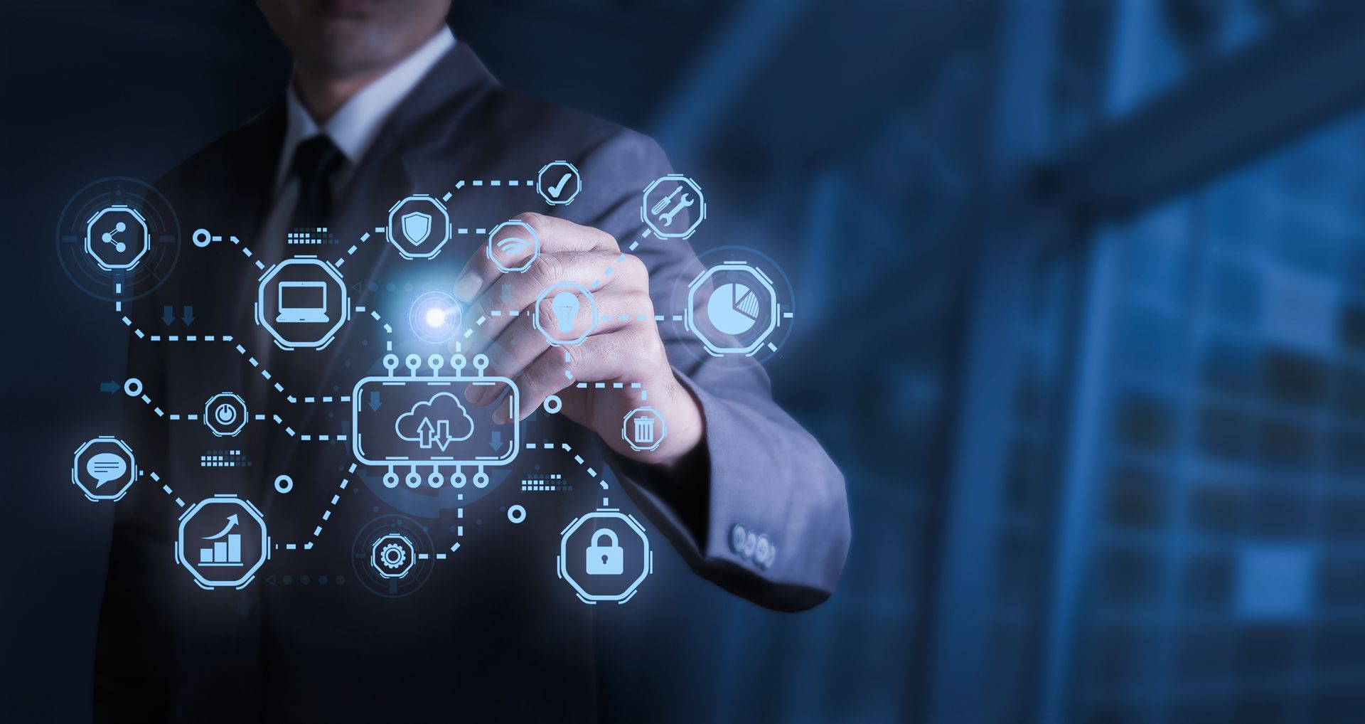 Businessman in a suit interacting with a glowing cloud computing network graphic. Blue tones.