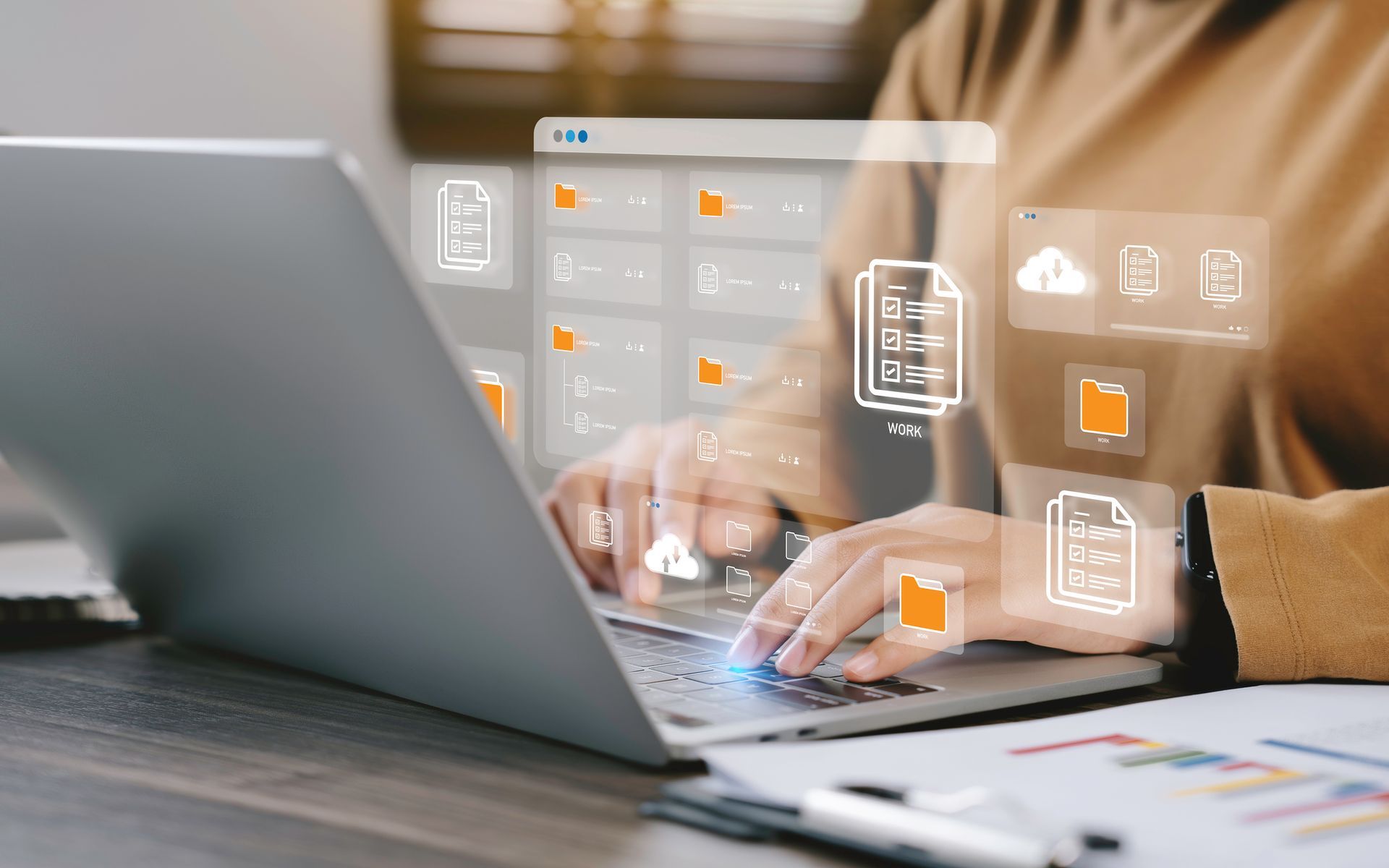 Person typing on laptop, with digital file icons overlayed.