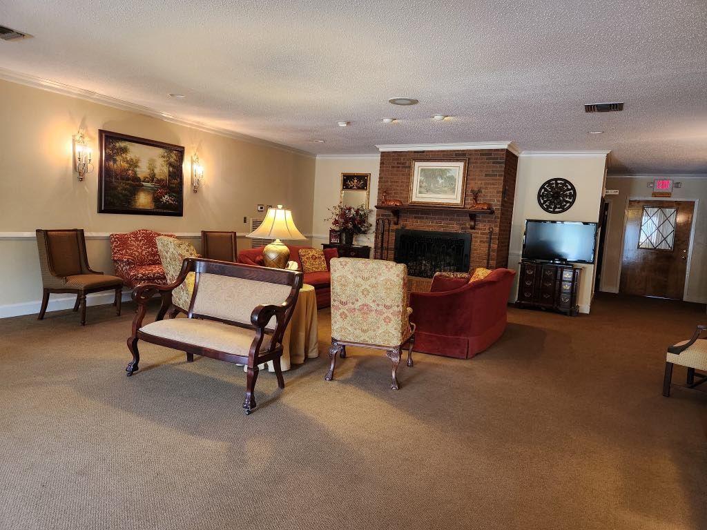 A living room filled with furniture and a fireplace.