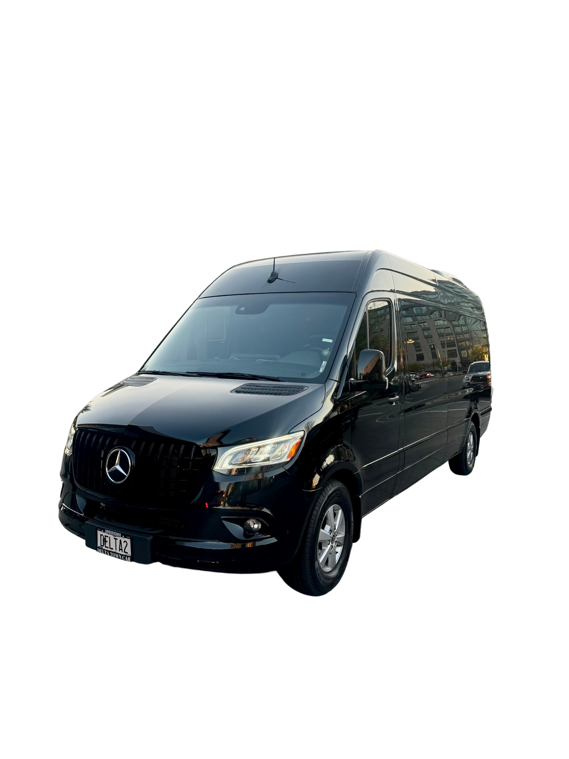 Black Mercedes-Benz Sprinter van, possibly for passenger transport, against a white backdrop.