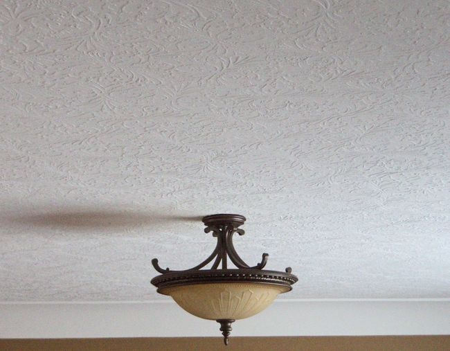 a ceiling light is hanging from the ceiling in a room