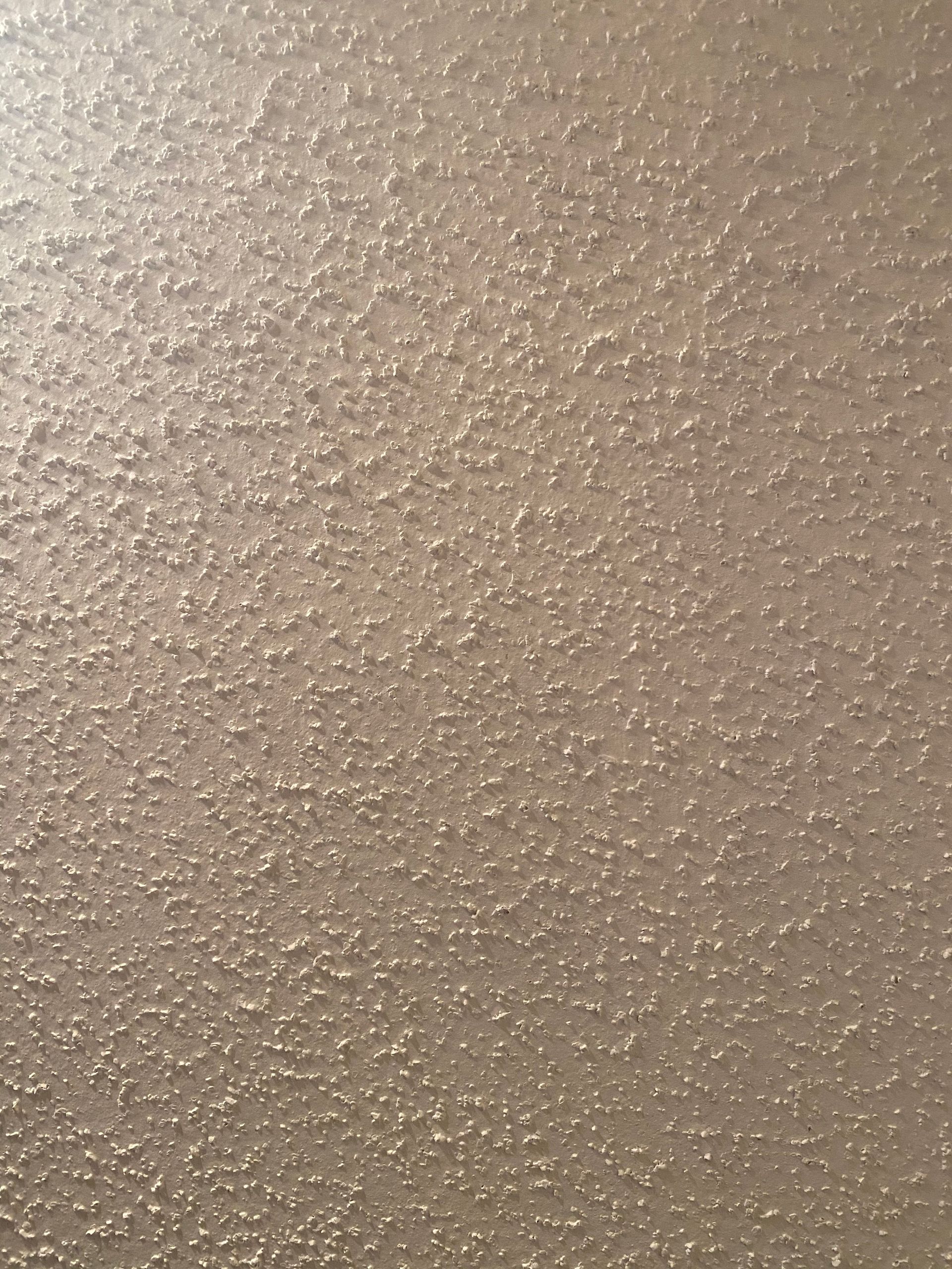 a close up of a white surface with a grainy texture .