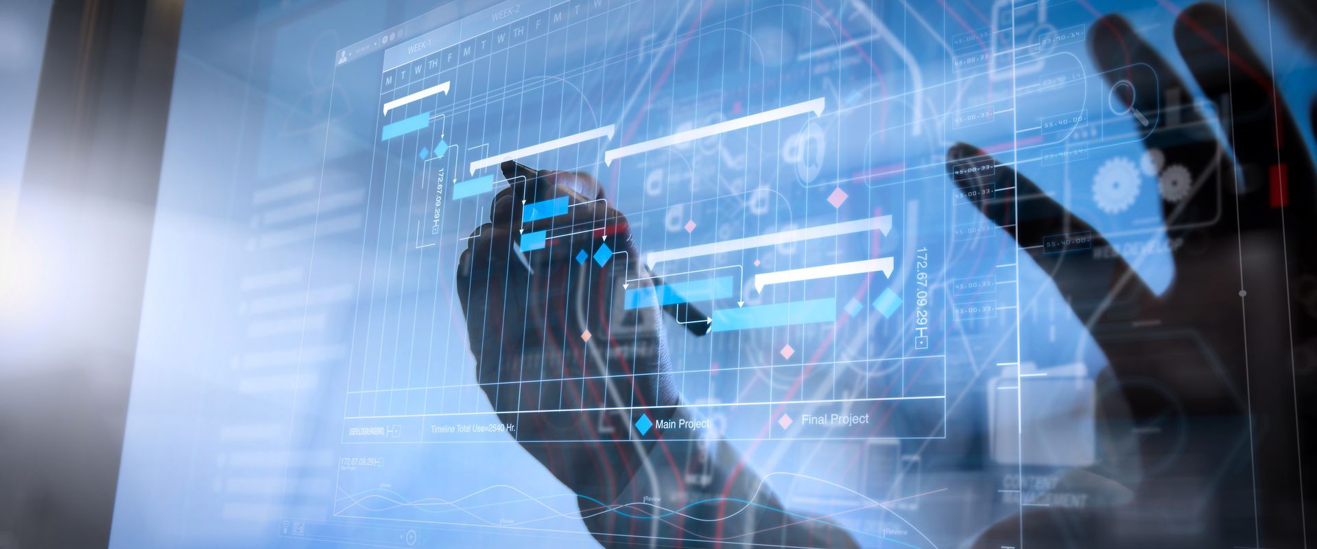 Hands interacting with a blue futuristic digital interface on a glass screen