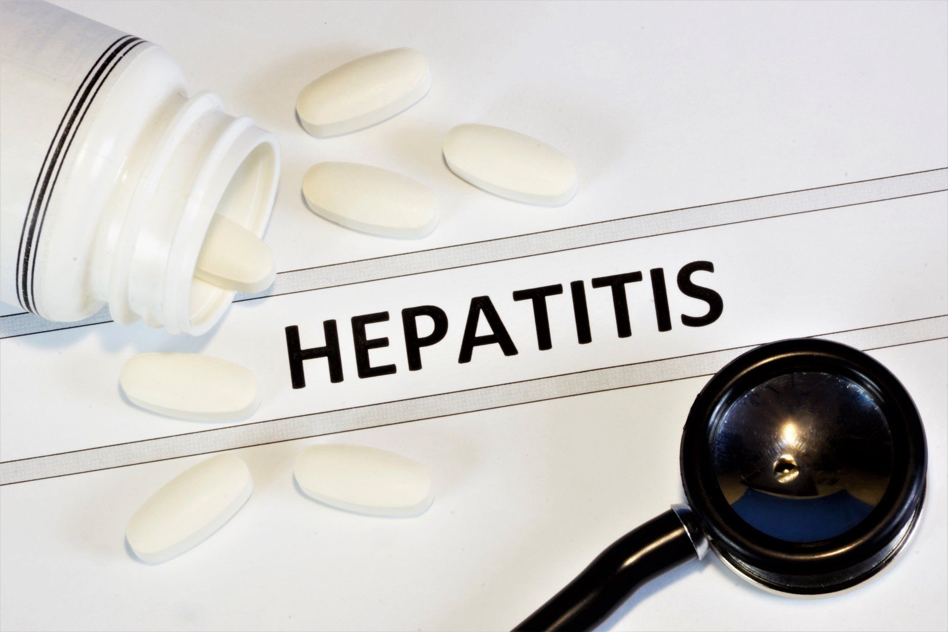 Hepatitis sign with medicine and stethoscope