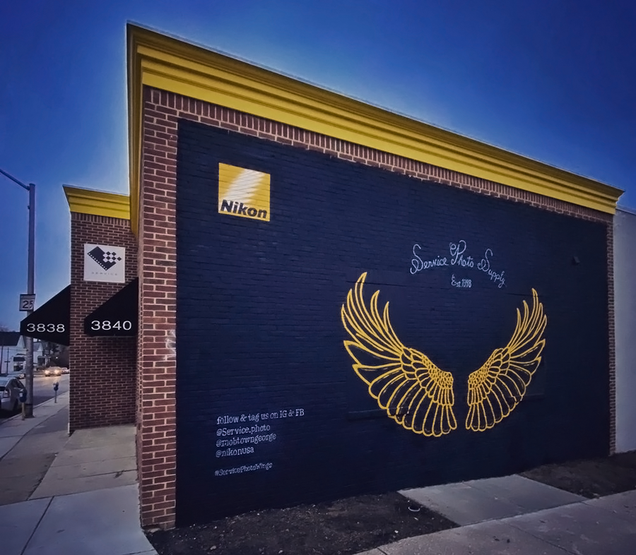 A brick building with a nikon logo on it