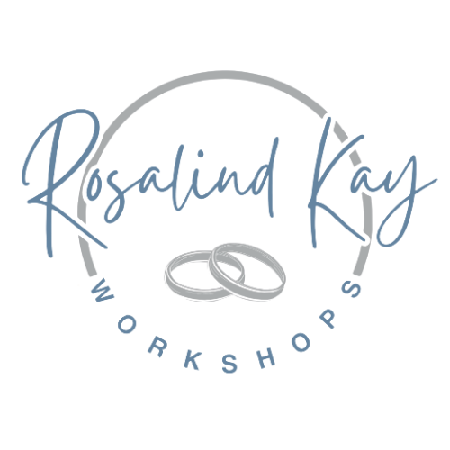 A logo for rosalind kay workshops with two wedding rings in a circle.