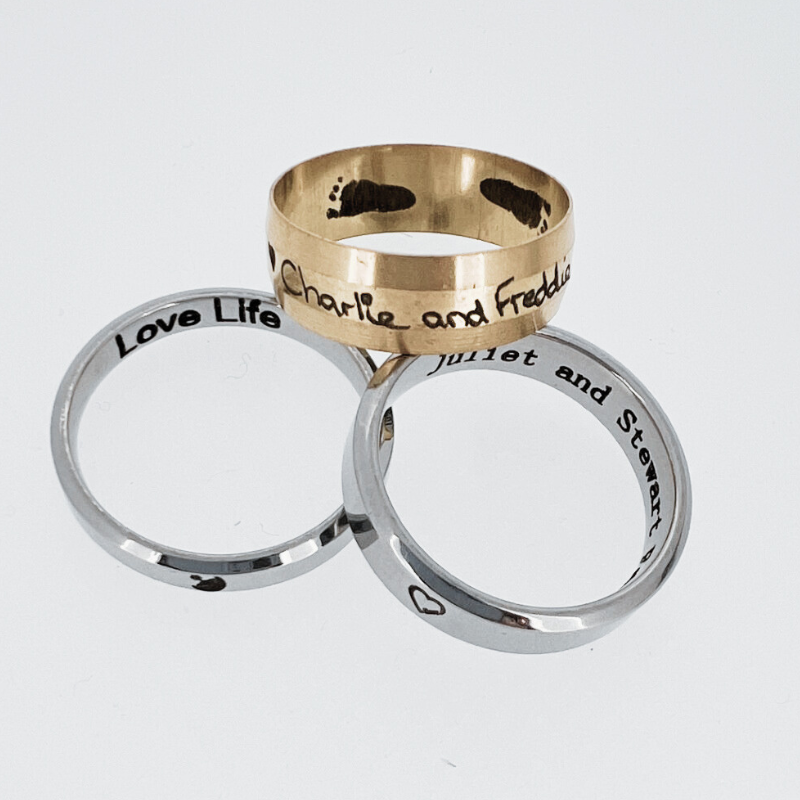 Three rings with one that says love life on it