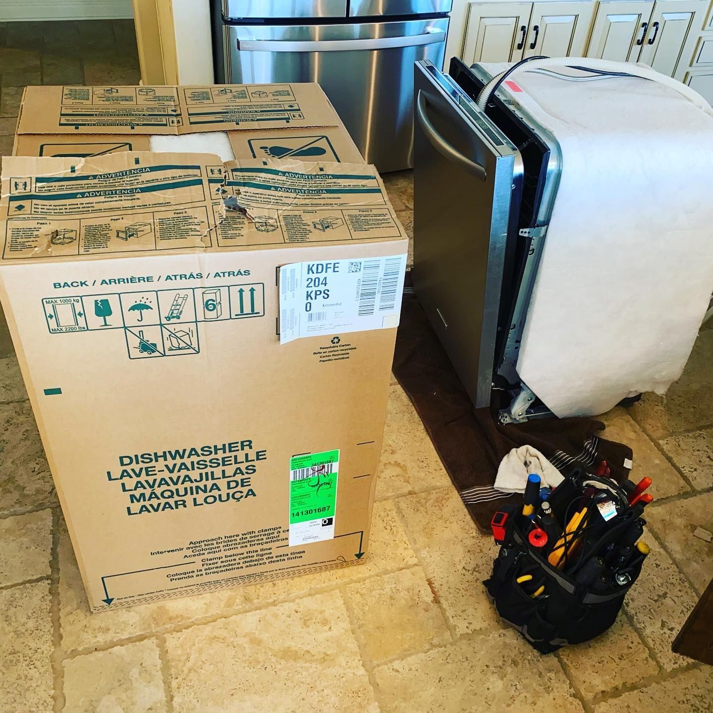 A cardboard box with the word dishwasher on it