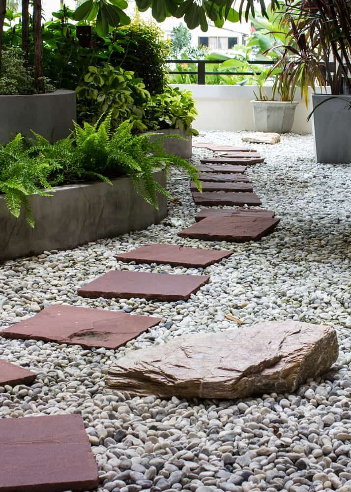 Garden With a Path of Red Stepping Stones on White Pebbles — Ourimbah Landscape Supplies In Ourimbah, NSW