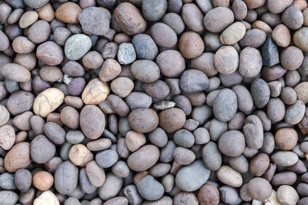 Multicoloured Pebbles Tightly Packed Together — Ourimbah Landscape Supplies In Ourimbah, NSW