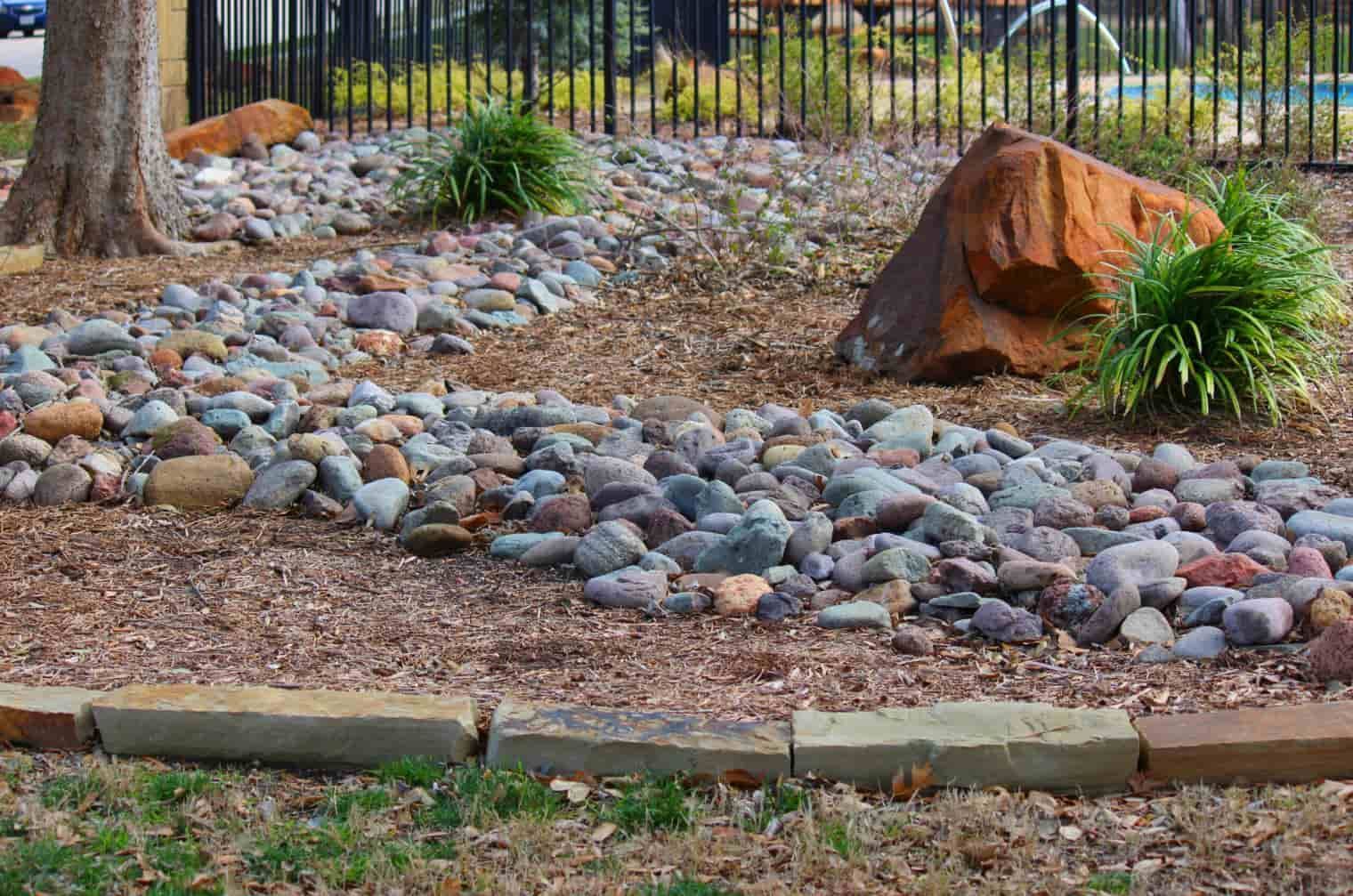 A Garden Landscape Features Multicoloured Stones — Ourimbah Landscape Supplies In Ourimbah, NSW