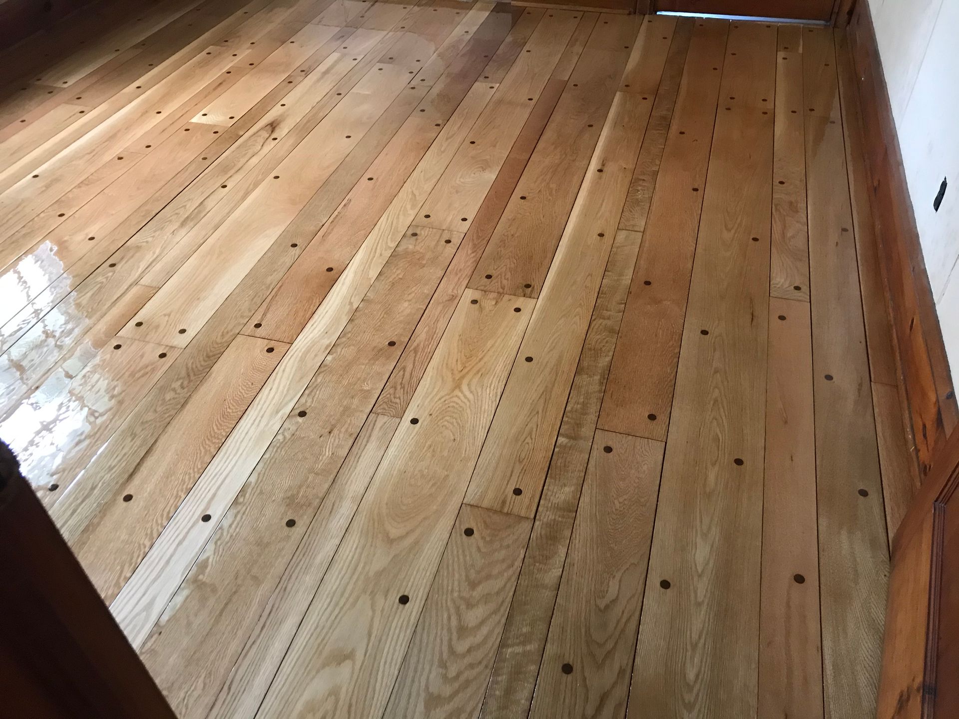 A close up of a wooden floor in a room