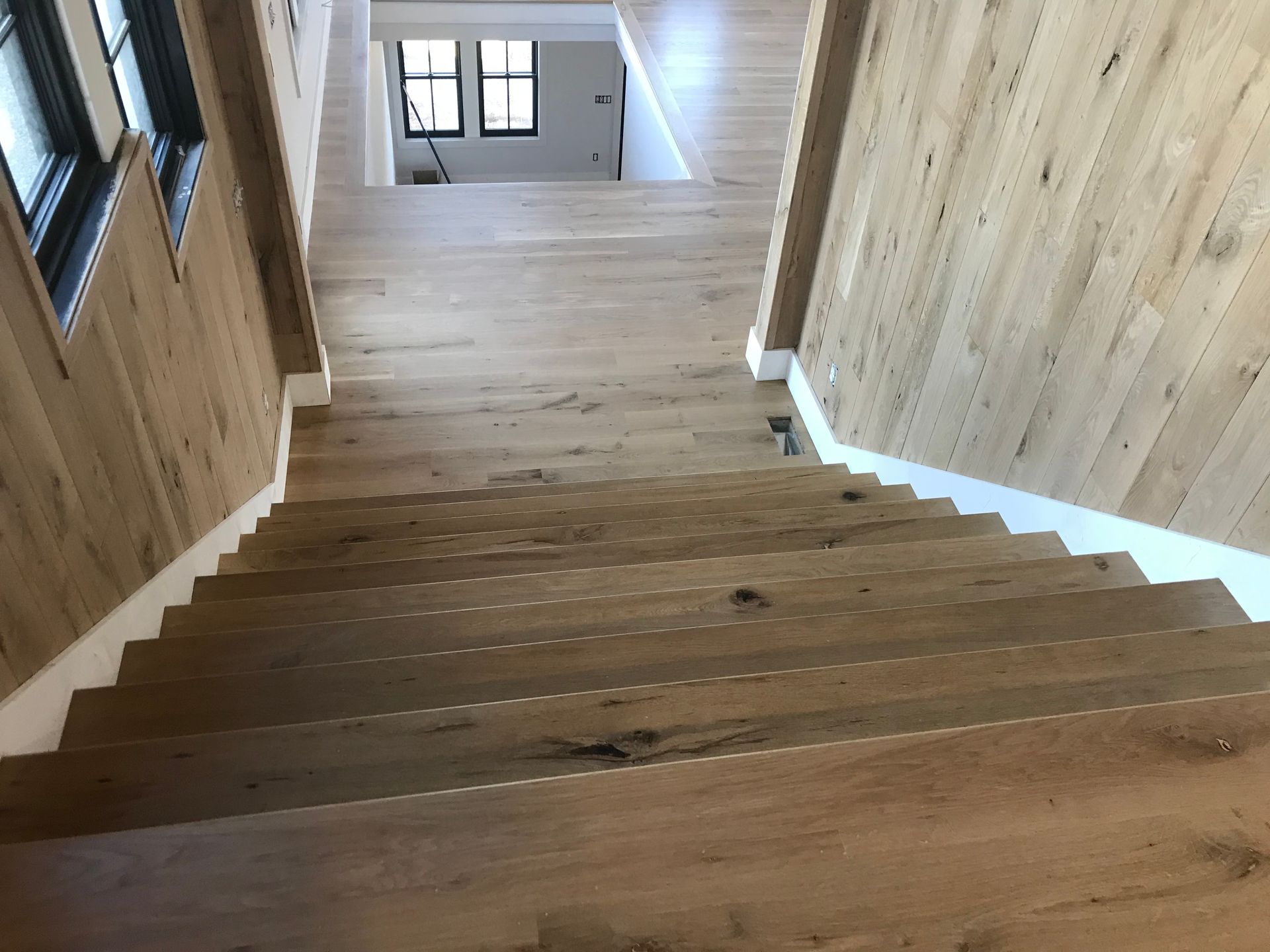 A wooden staircase leading up to the second floor of a house.