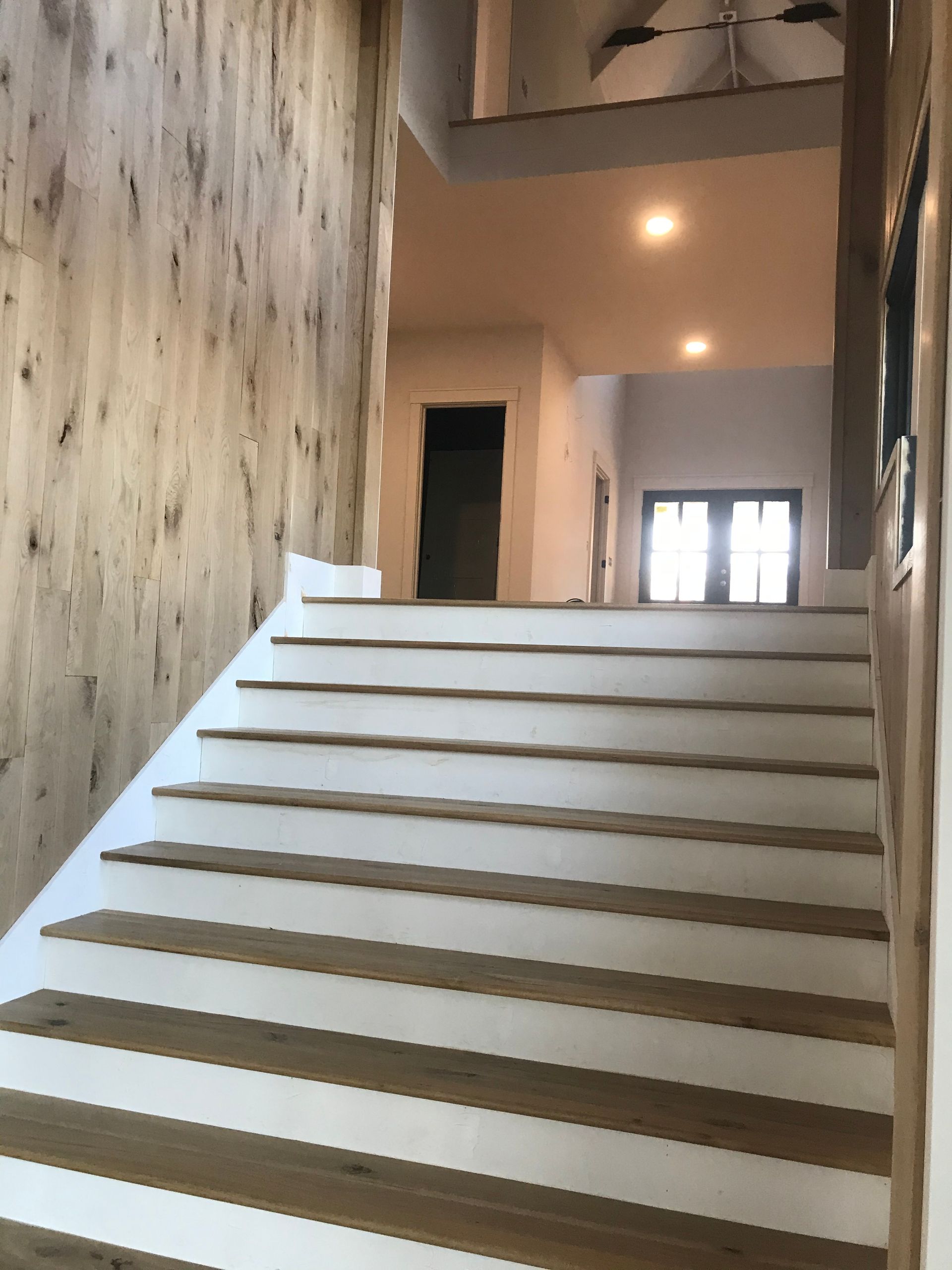 A set of stairs leading up to the second floor of a building.