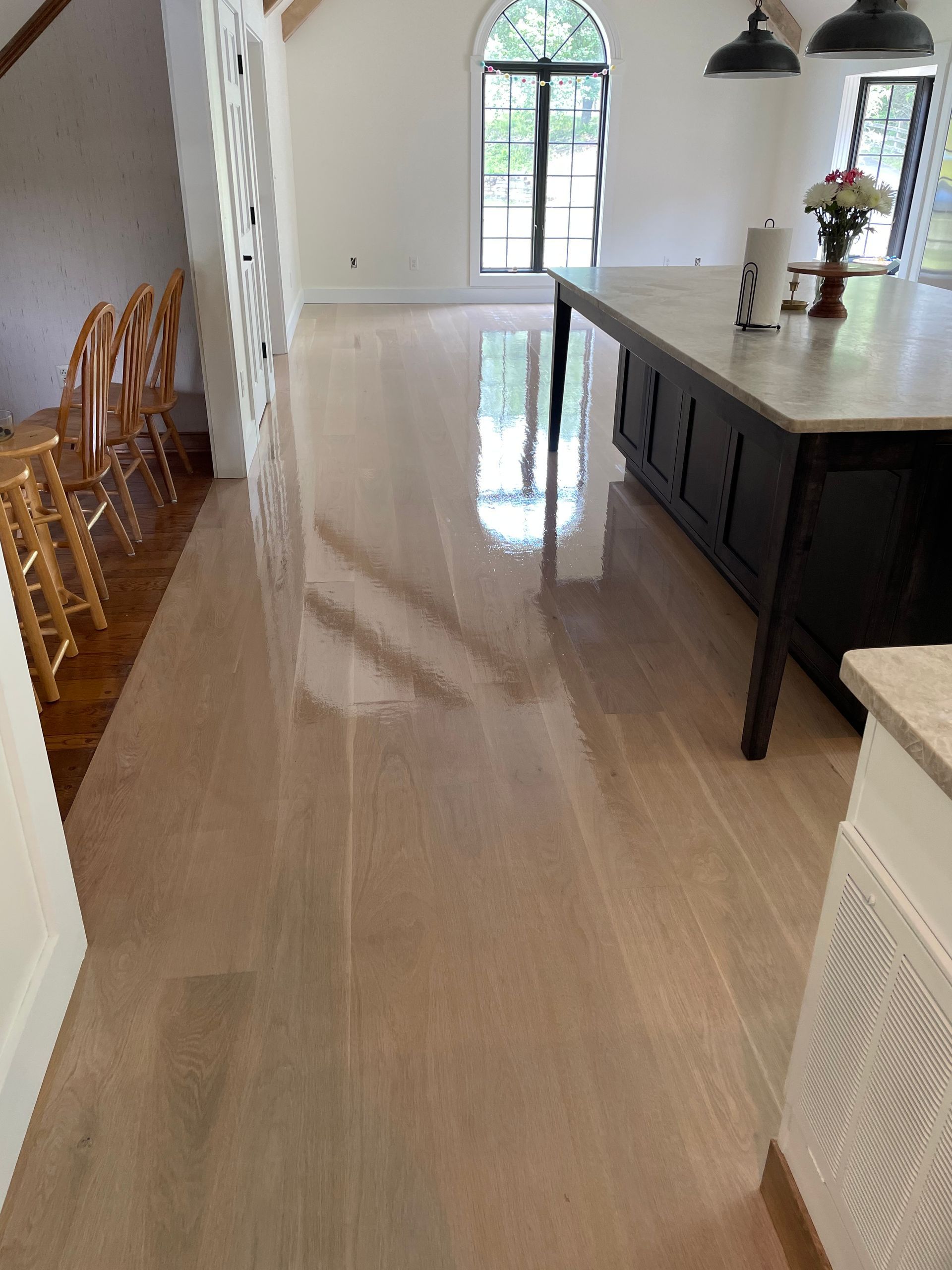 A kitchen with a large island in the middle of the room.